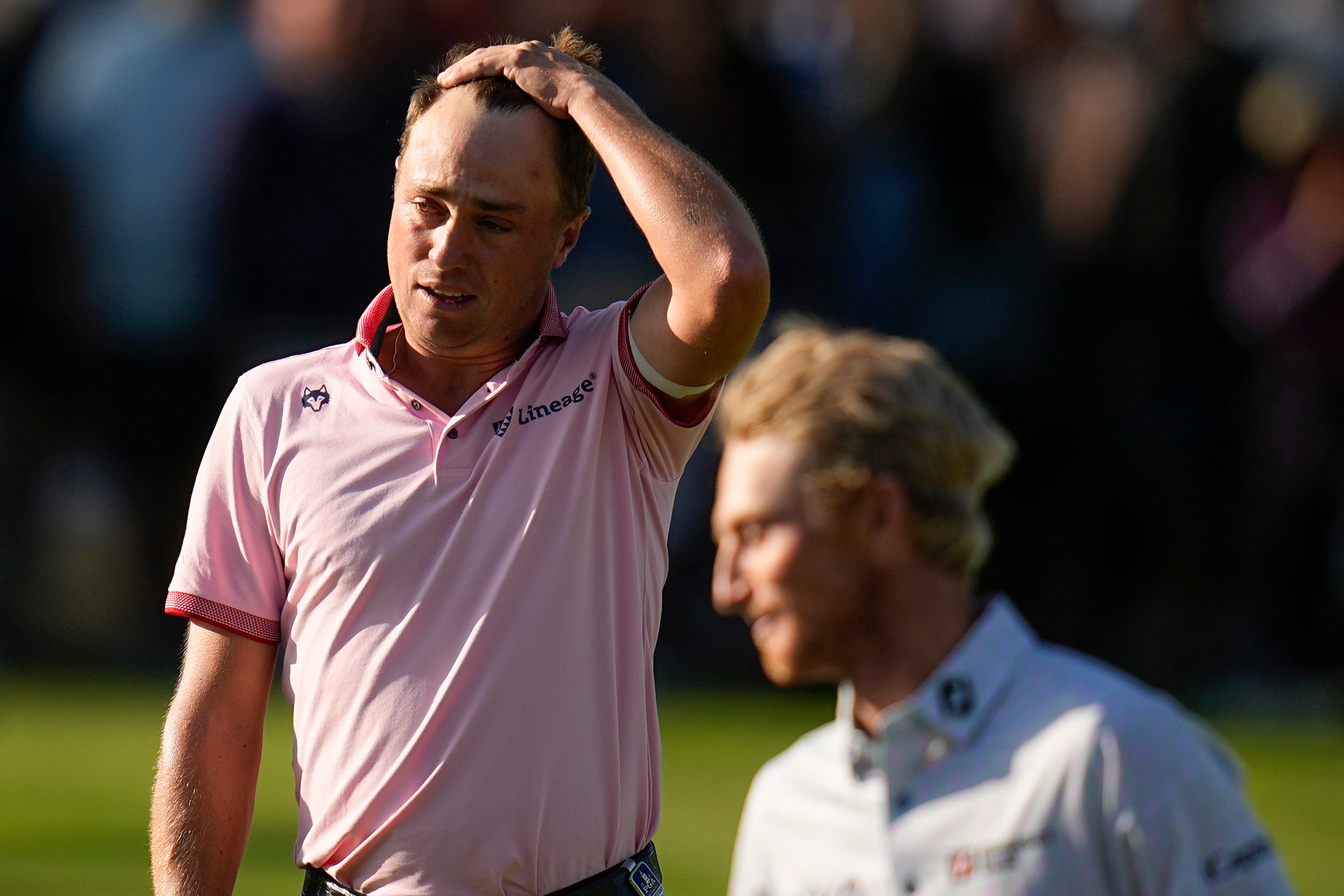 Justin Thomas (left) reacts after beating Will Zalatoris in a play-off to win the US PGA Championship (Sue Ogrocki/AP)