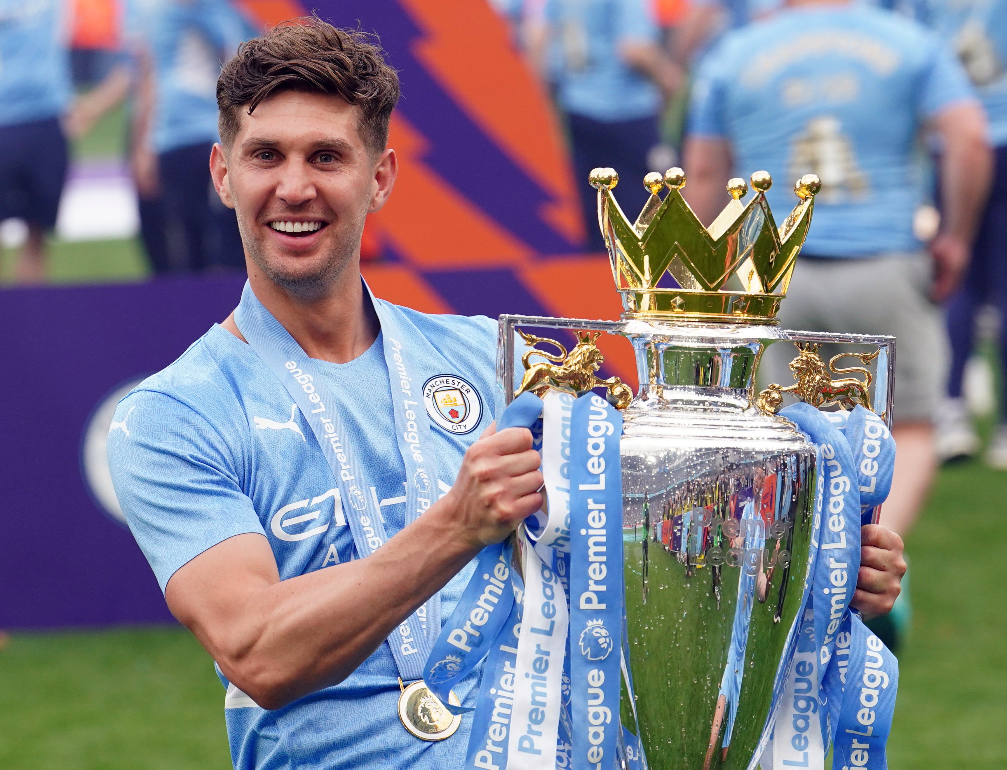 John Stones is celebrating his fourth Premier League success (Martin Rickett/PA)