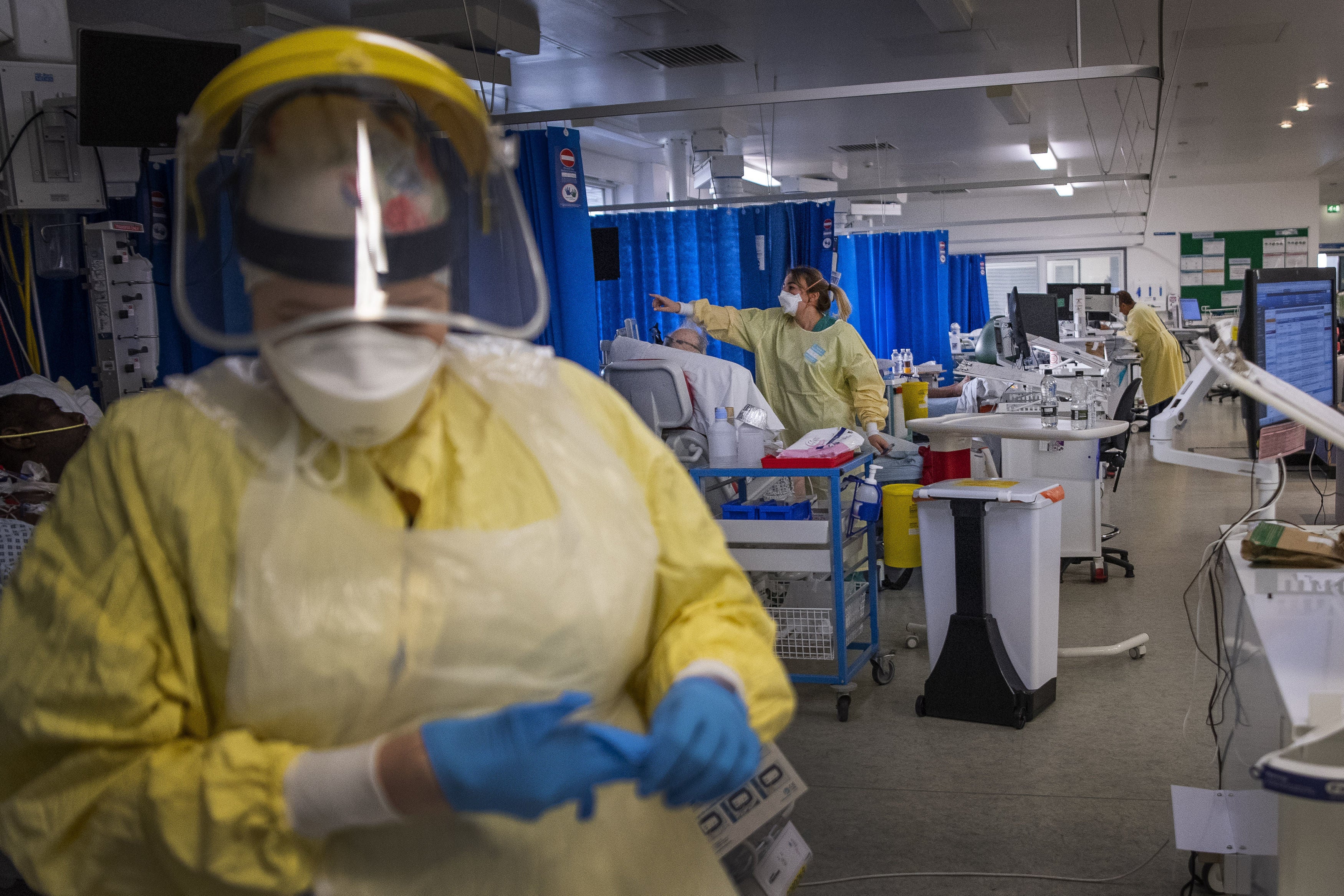 A nurse wearing PPE works on a patient in the ICU (Intensive Care Unit) in St George's Hospital in Tooting, south-west London.