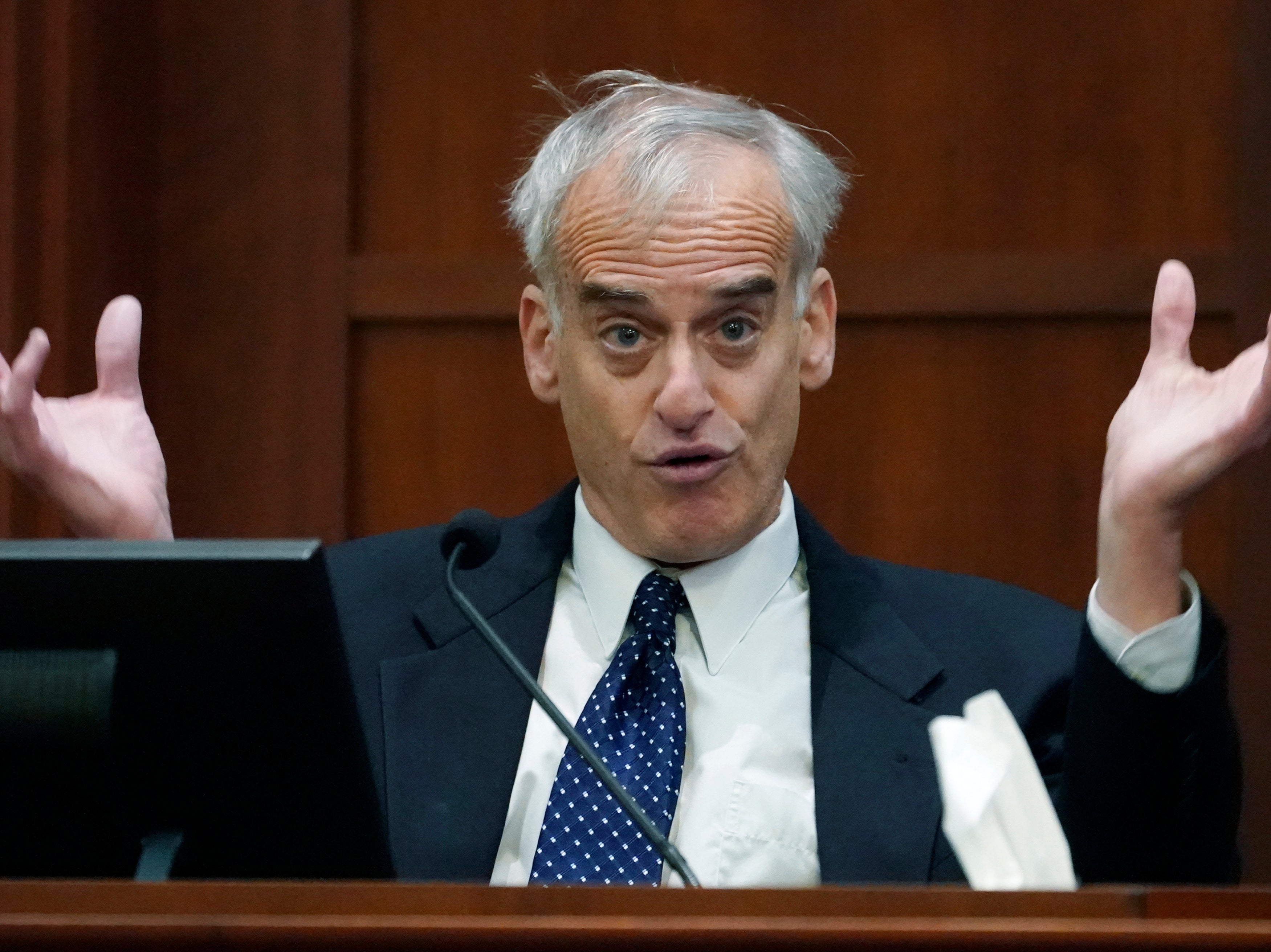 Dr. David Spiegel testifies in the courtroom at the Fairfax County Circuit Courthouse in Fairfax, Virginia, USA, 23 May 2022