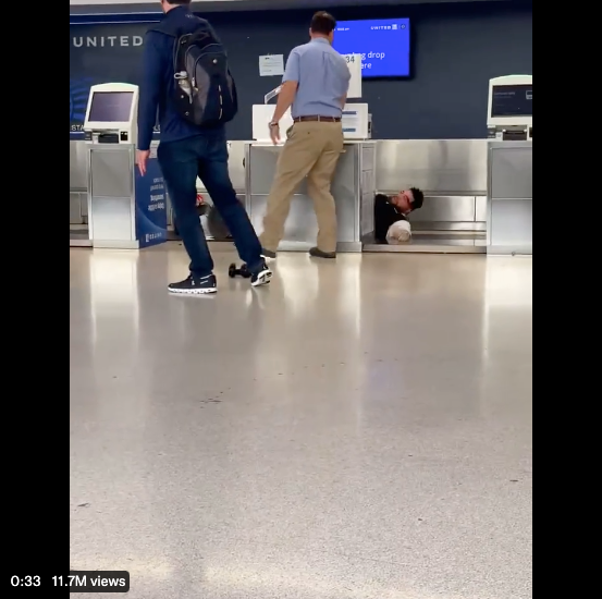 A United Airlines worker and a passenger got into a fist fight at Newark International Airport, leading to the employee getting knocked over the check-in desk and onto the conveyor belt.