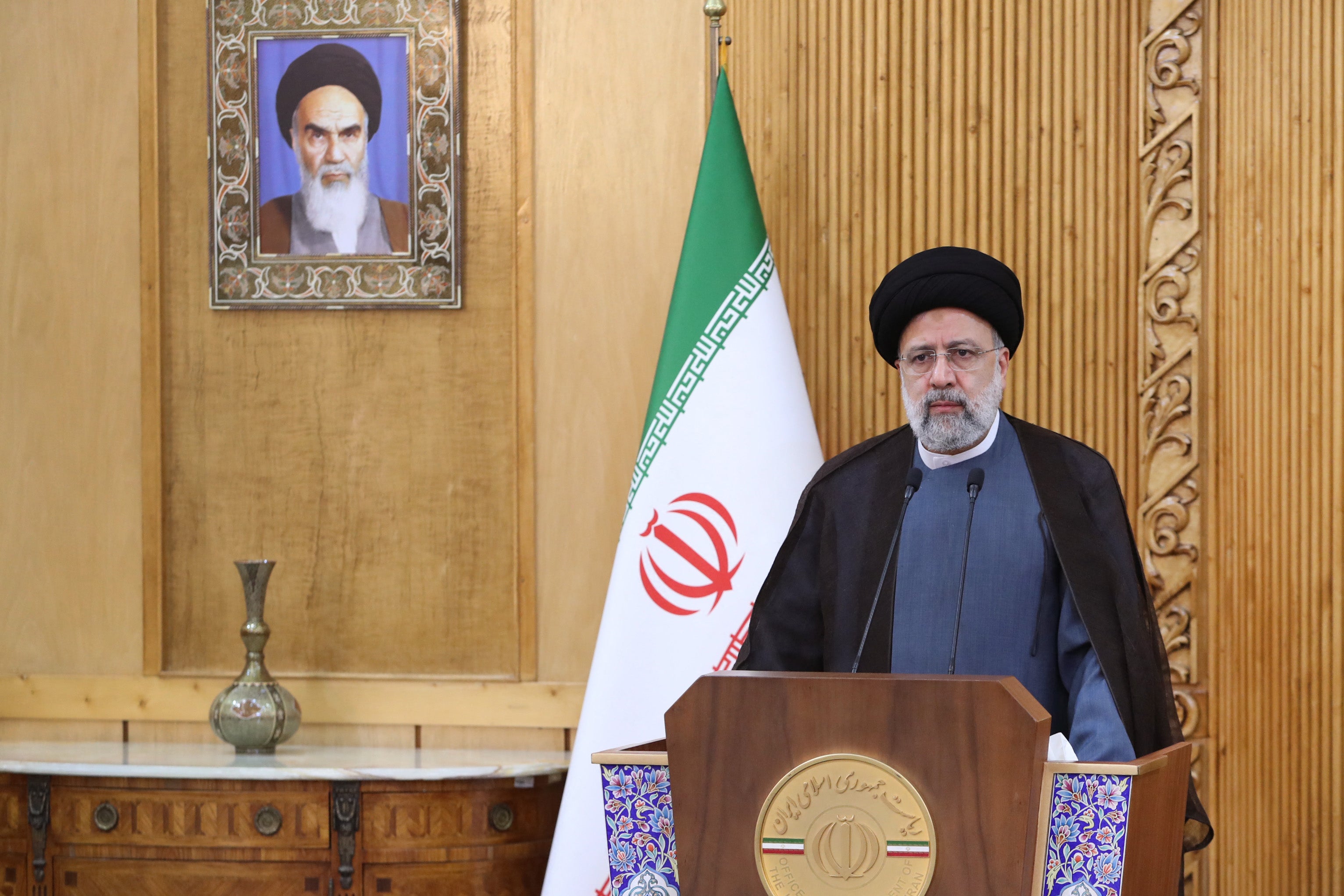 Iran's President Ebrahim Raisi delivering a statement prior to departing Tehran’s Mehrabad airport to Oman for a visit