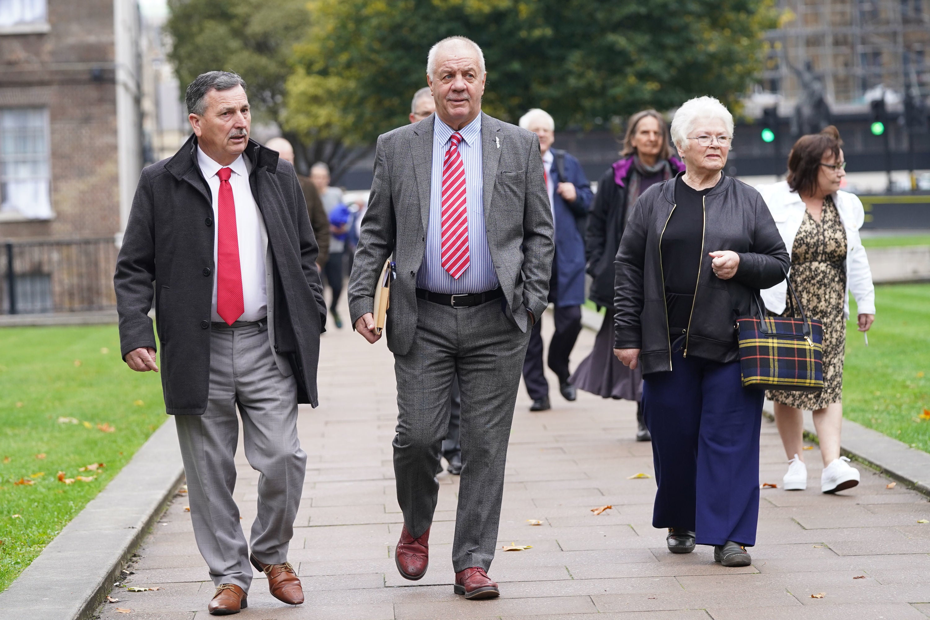 Raymond McCord (centre) leads the victims of The Troubles and their families through Parliament Square, Westminster. (Stefan Rousseau/PA)