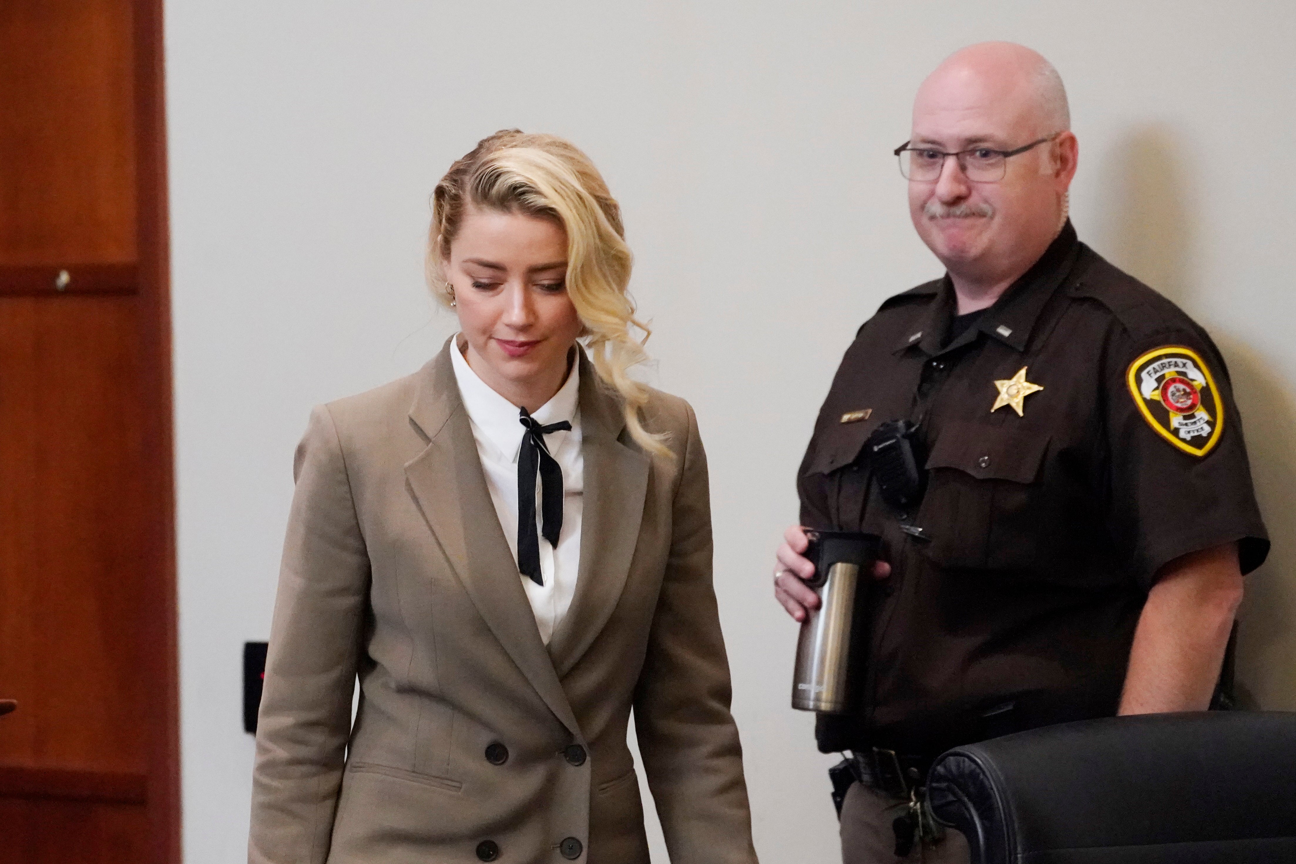 Actor Amber Heard arrives into the courtroom after a break at the Fairfax County Circuit Courthouse in Fairfax on 23 May