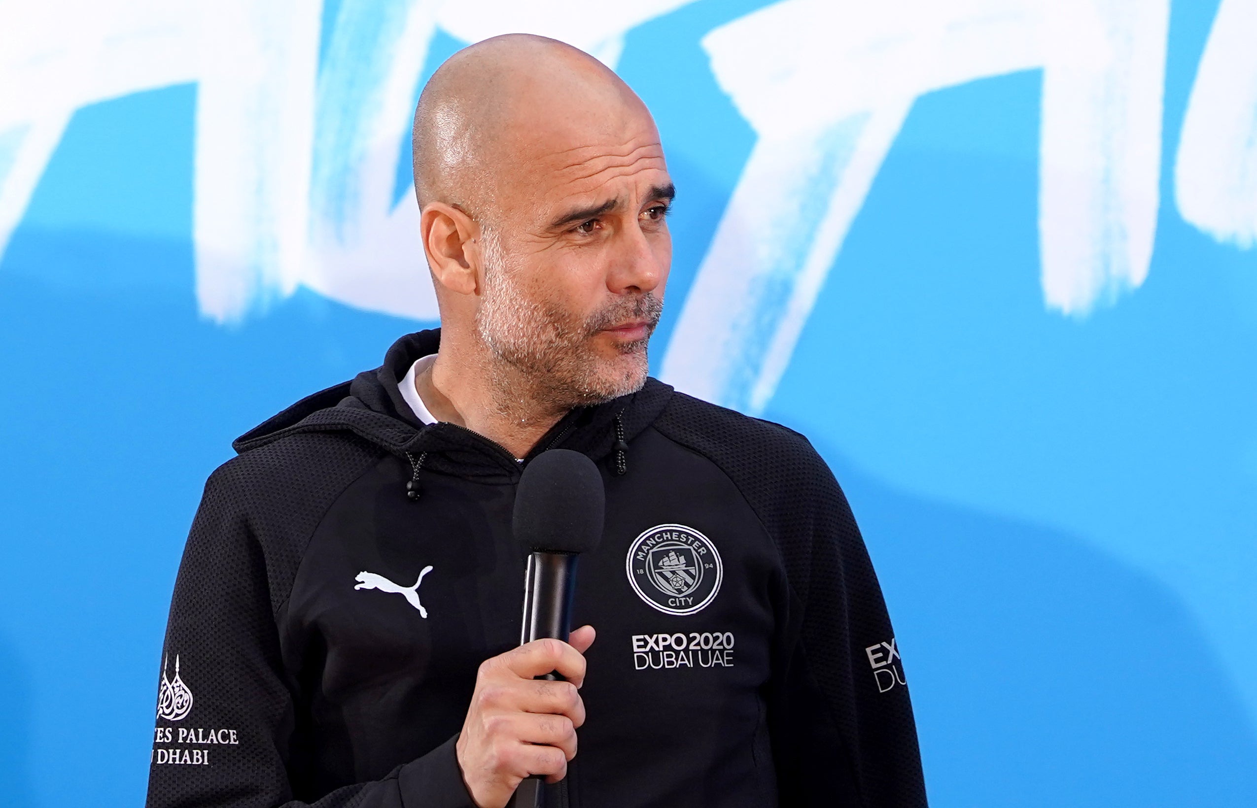 Manchester City manager Pep Guardiola on stage (Zac Goodwin/PA)