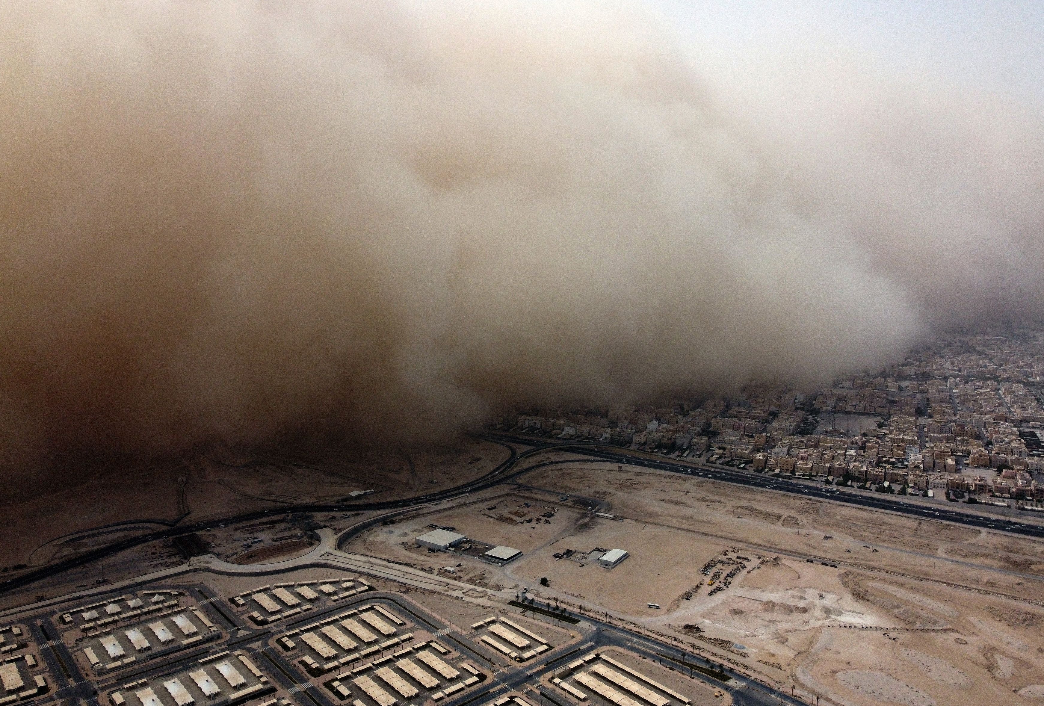 An aerial view of a massive dust storm advancing into Kuwait City