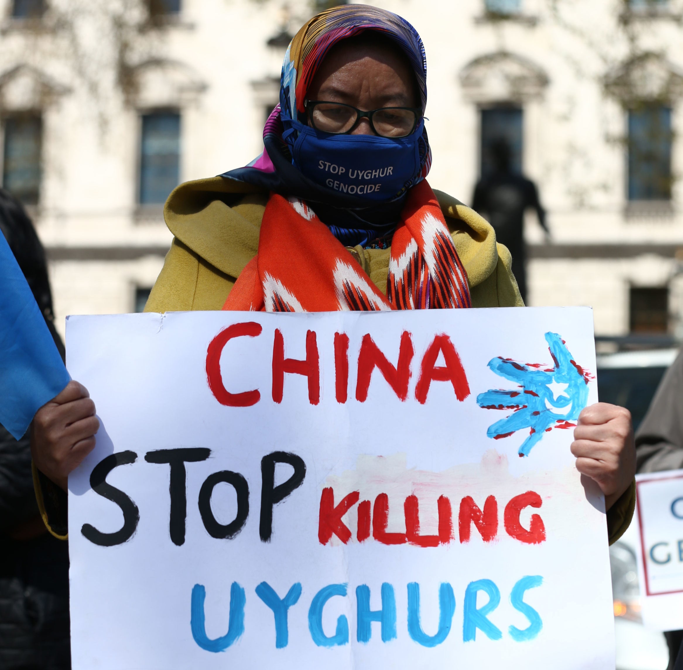 A Uyghur woman during a demonstration in Parliament Square, London