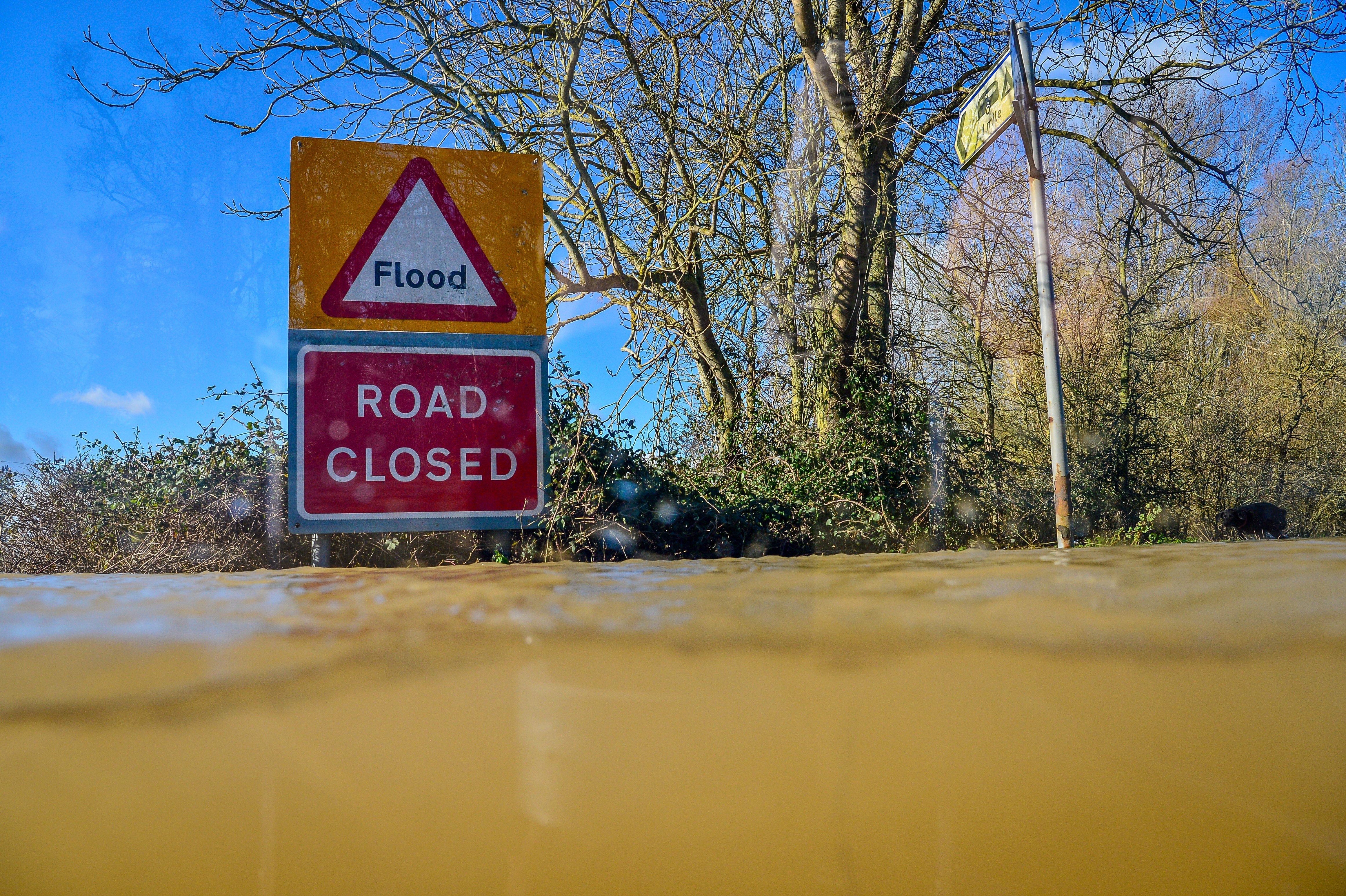 A report warns some households, such as those in flood-prone areas, could struggle to access affordable loans and insurance in the future (Ben Birchall/PA)