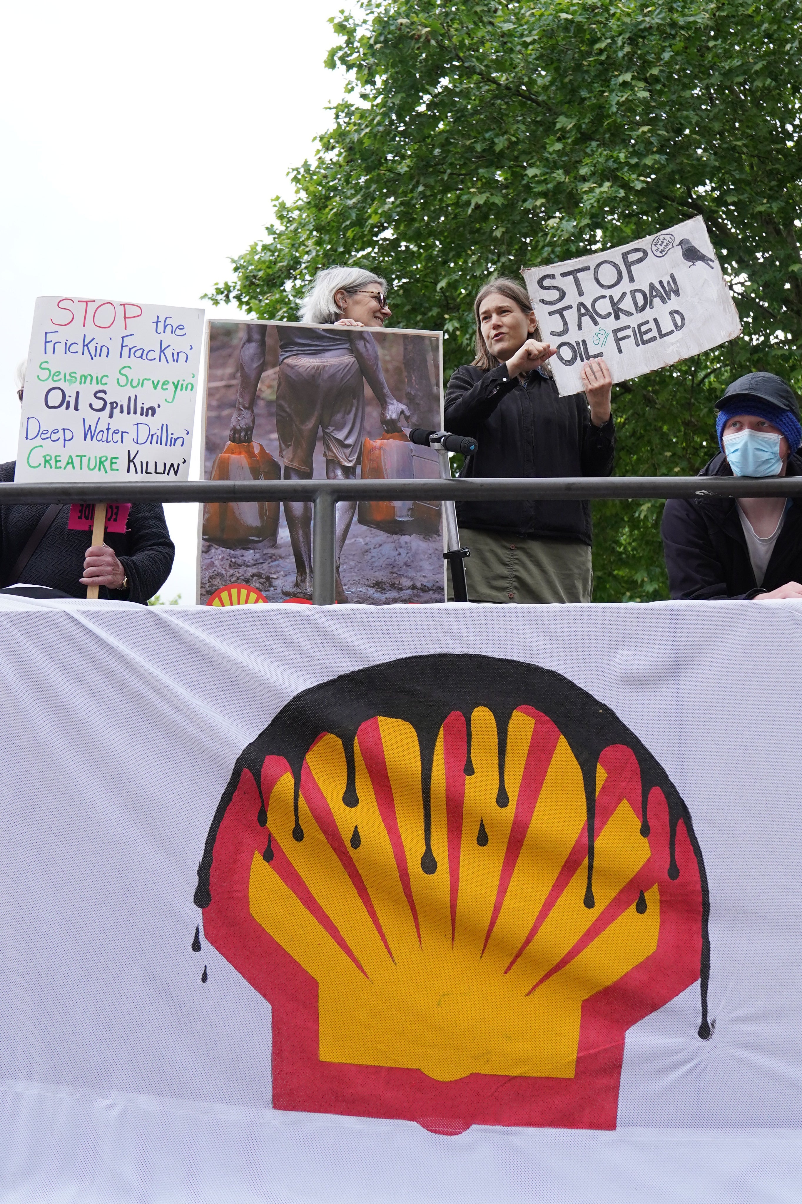 Protesters gathered both inside and outside the meeting hall (Stefan Rousseau/PA)