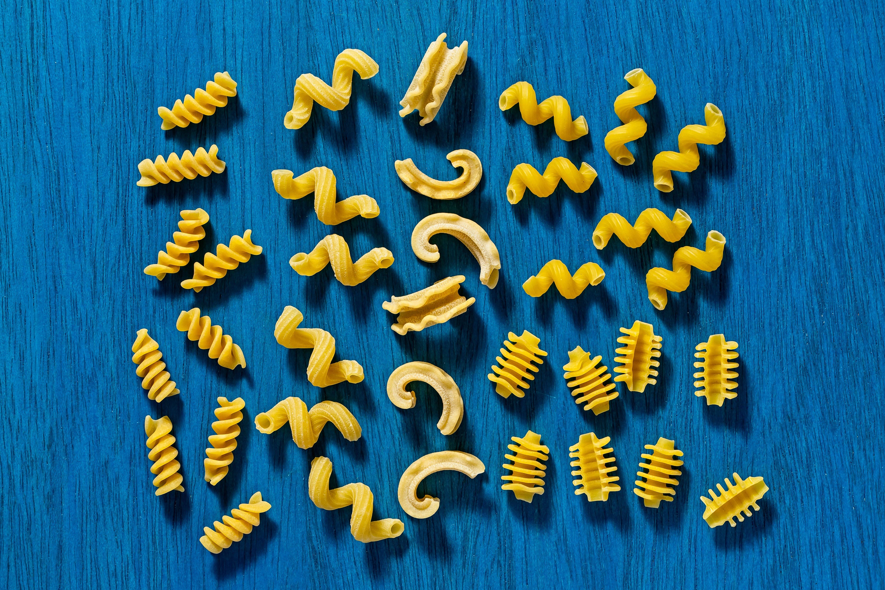 From left, rotini, cavatappi, cascatelli, cavatappi with radiatori underneat