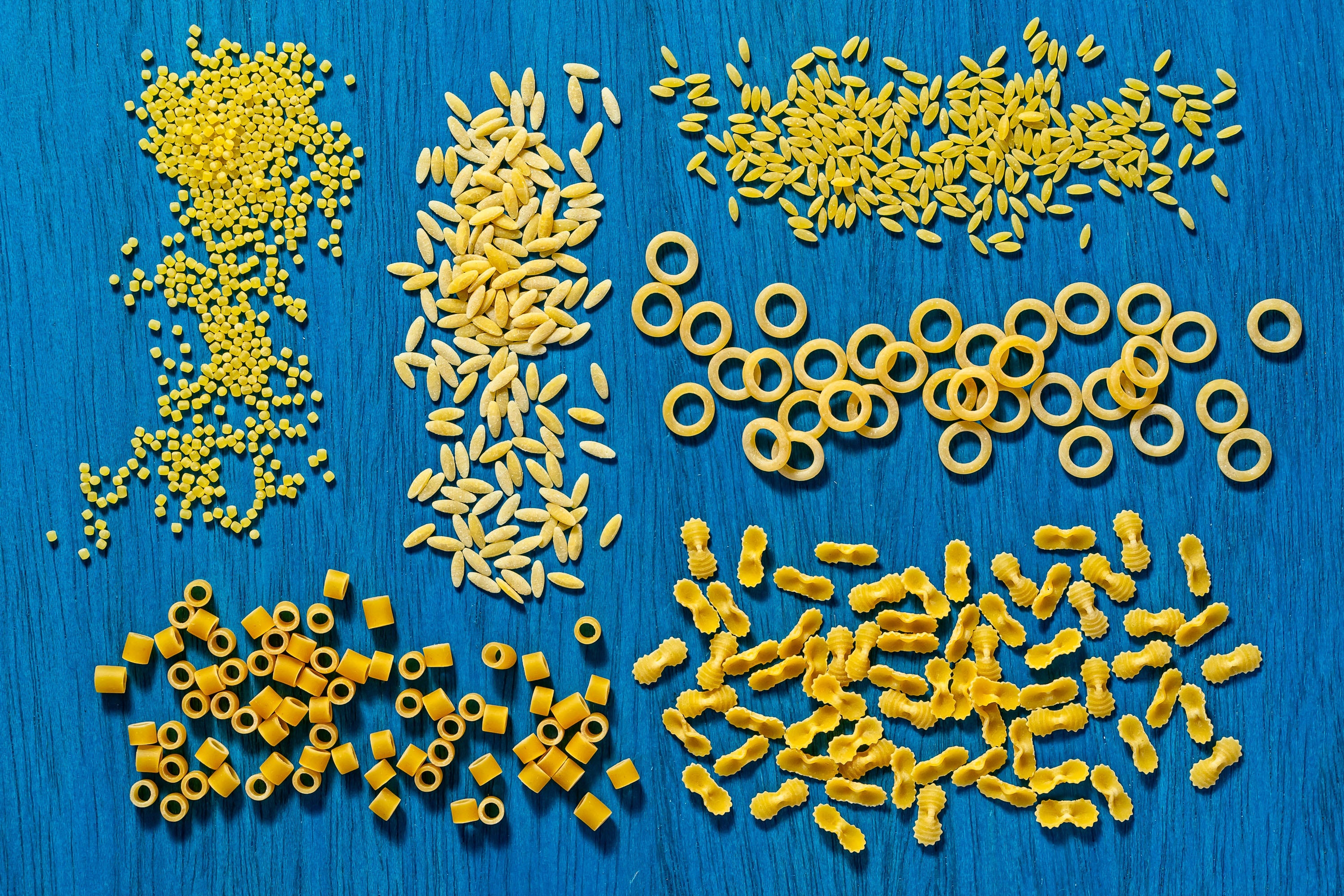 Clockwise, from top left, acini, orzo, orzo no 74, anelletti, farfalline and ditalini