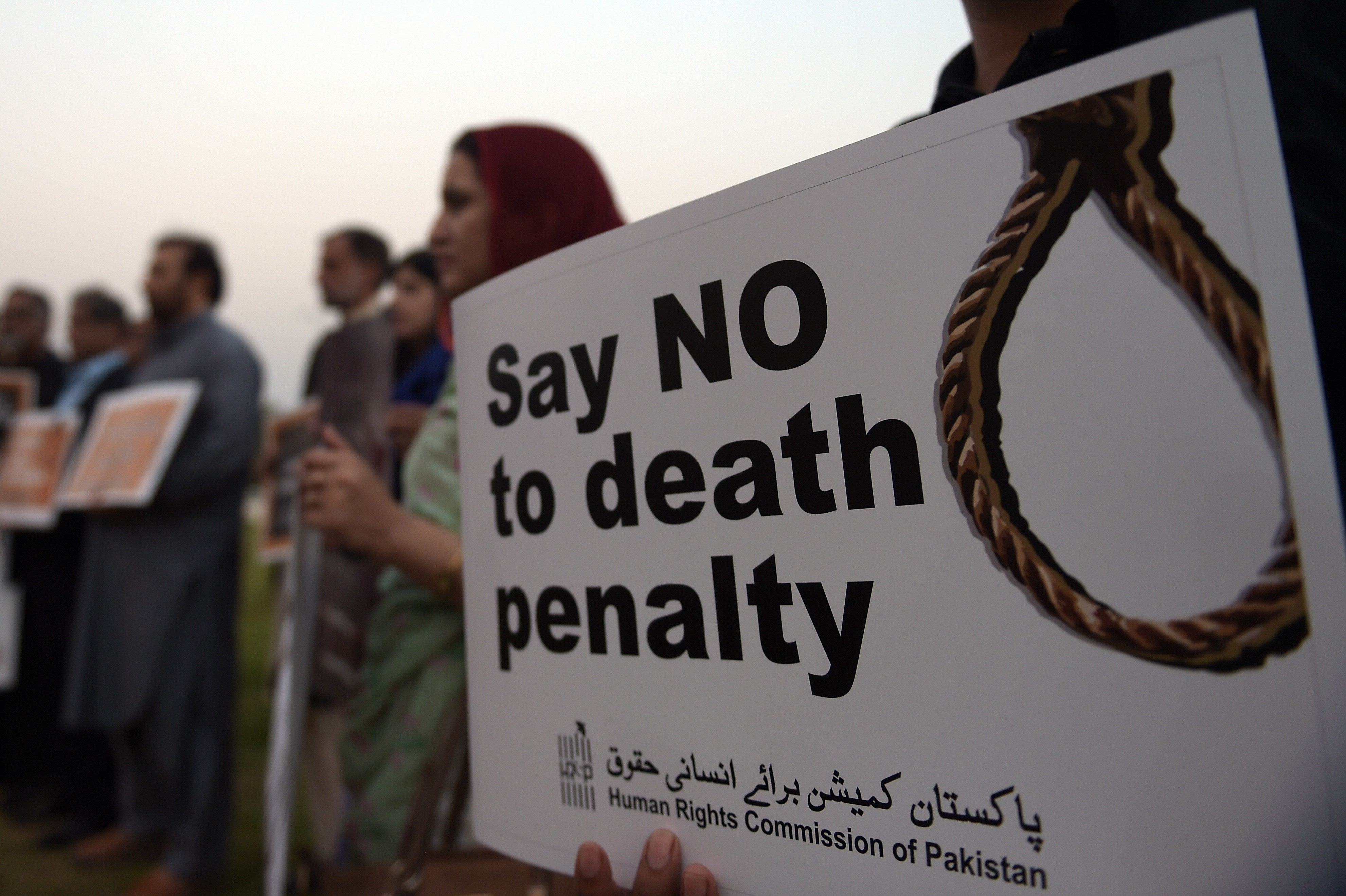 Activists from the Human Rights Commission of Pakistan carry placards during a demonstration to mark International Day Against the Death Penalty in Islamabad