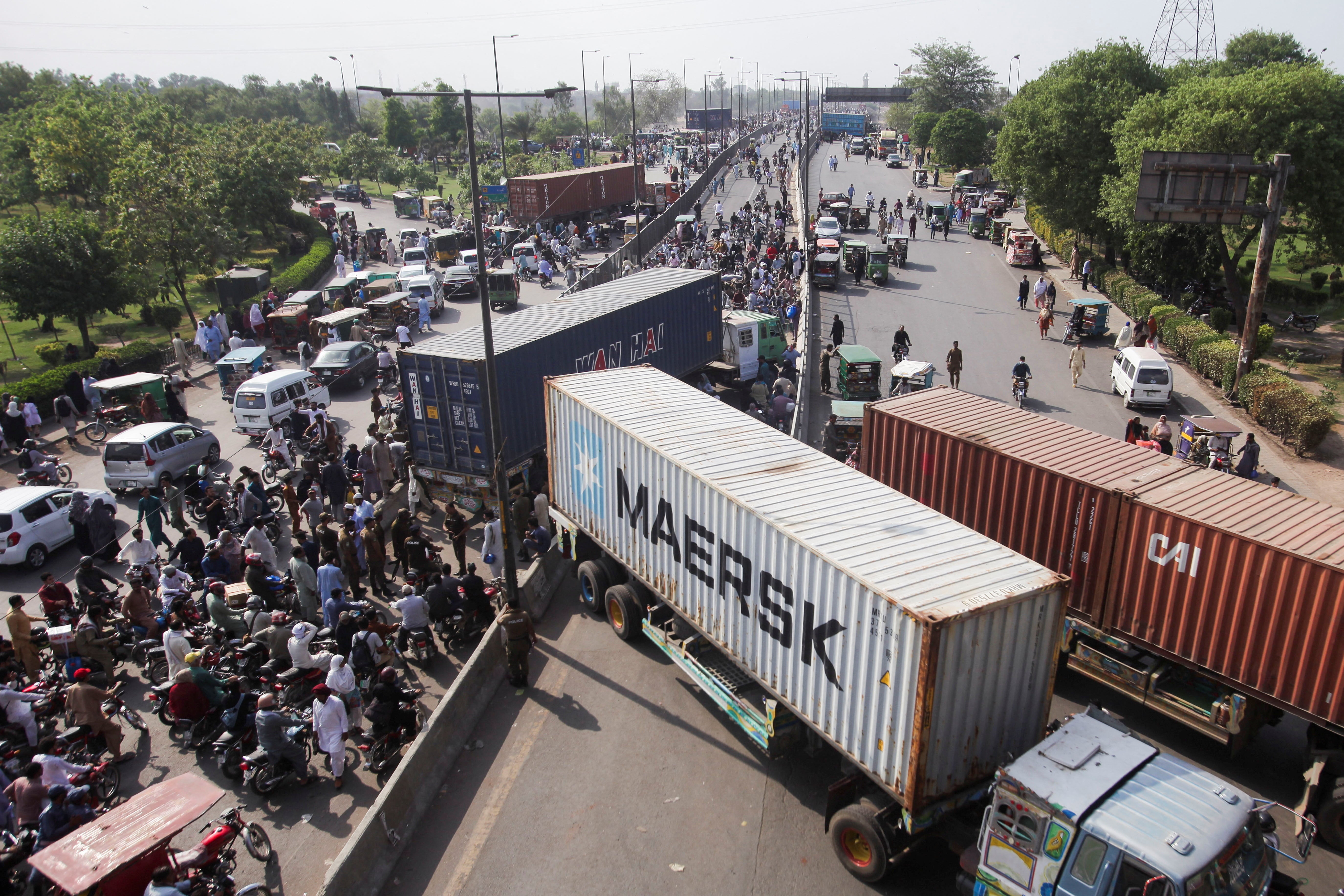 Vehicles with shipping containers to block the roads ahead of the planned protest march on Tuesday