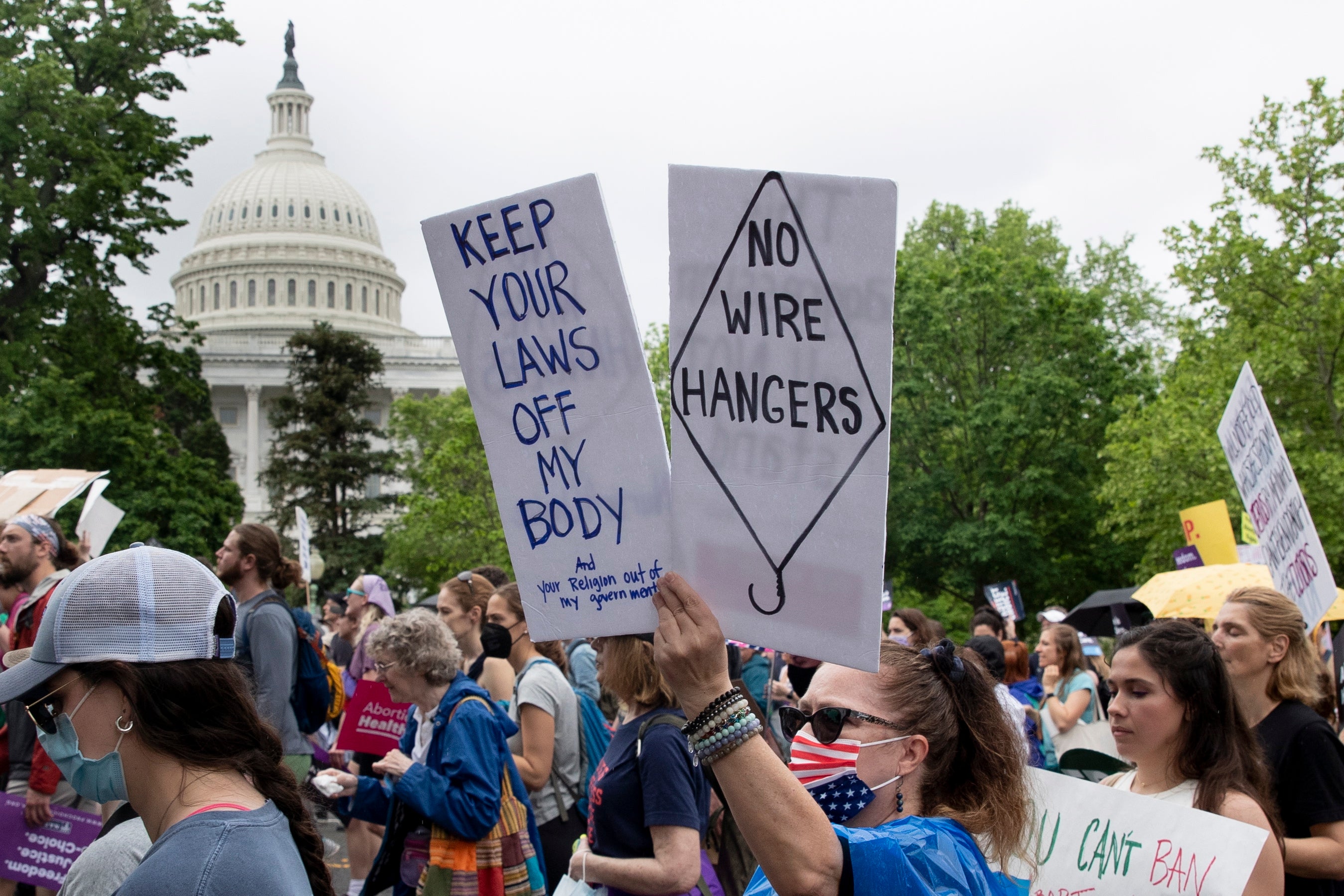 Abortion rights supporters march past the US Capitol on their way from the Washington Monument to the Supreme Court in Washington, DC