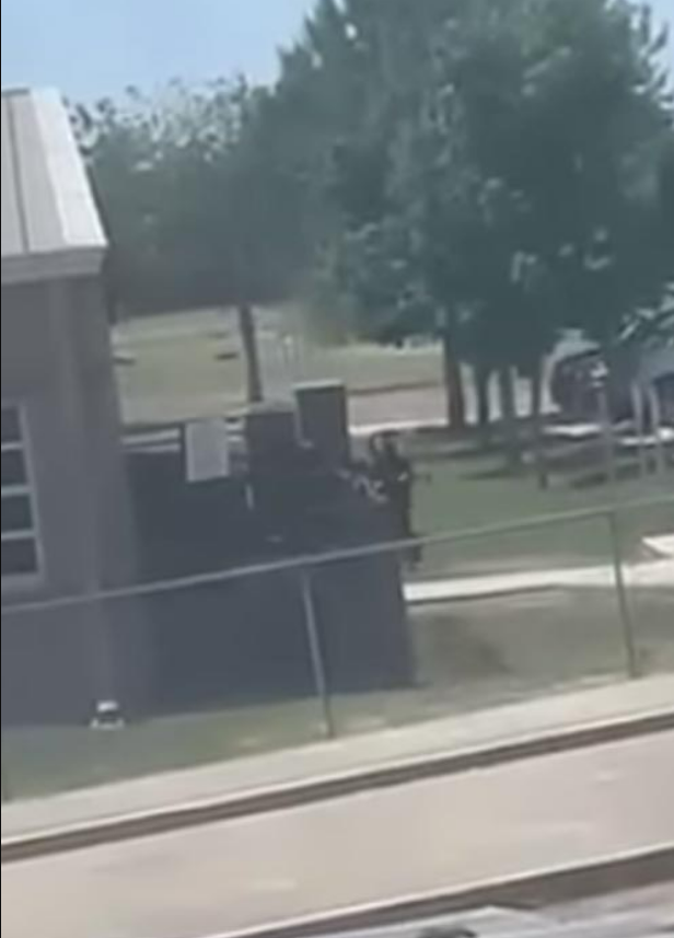 An eerie video was posted on social media on the day of the Uvalde shooting, which shows the gunman tracing the perimeter of the elementary school, rifle in hand, before he would go onto break-in and barricade a classroom full of students and two teachers and open fire.