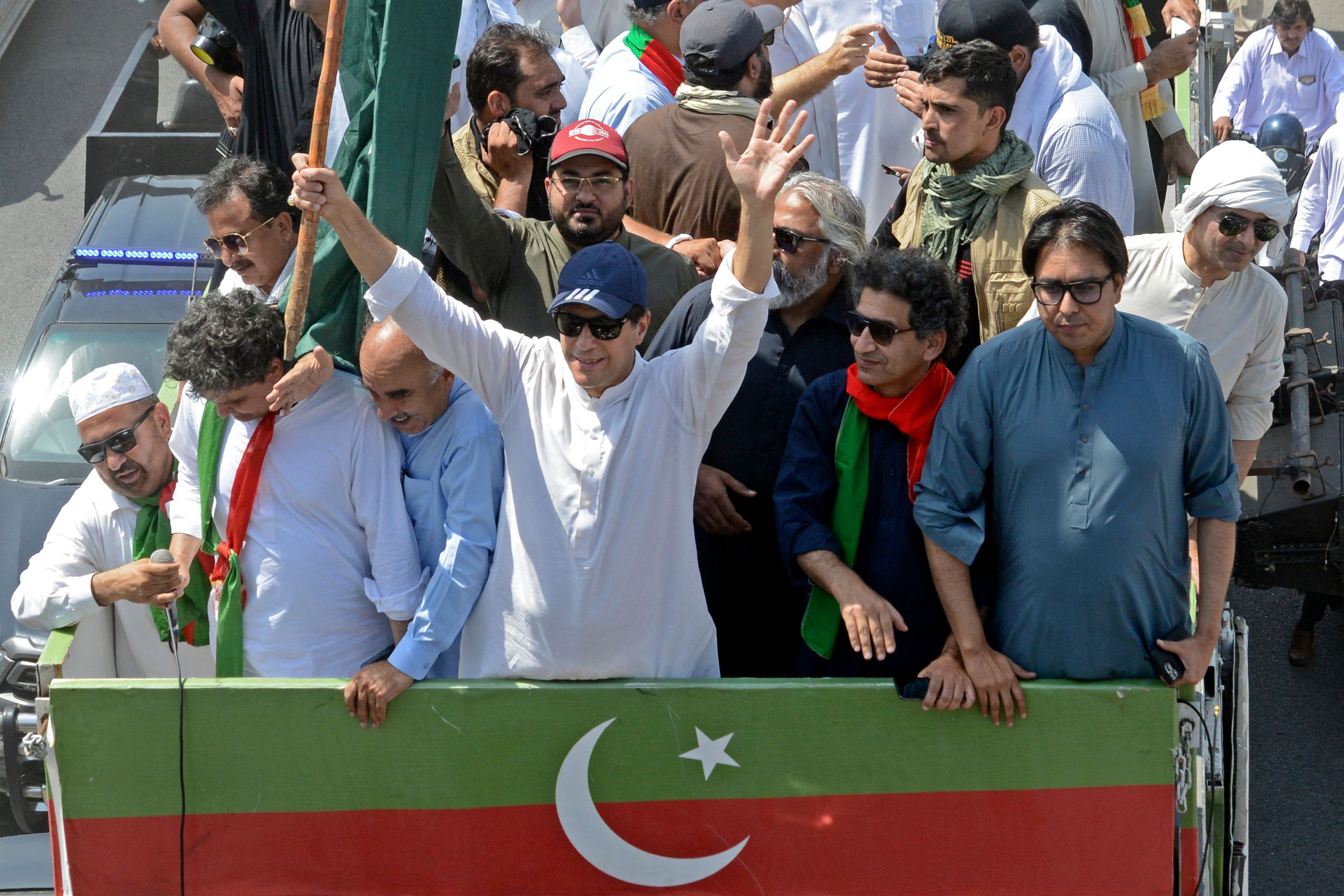 Imran Khan along with supporters take part in a protest rally in Swabi on Wednesday