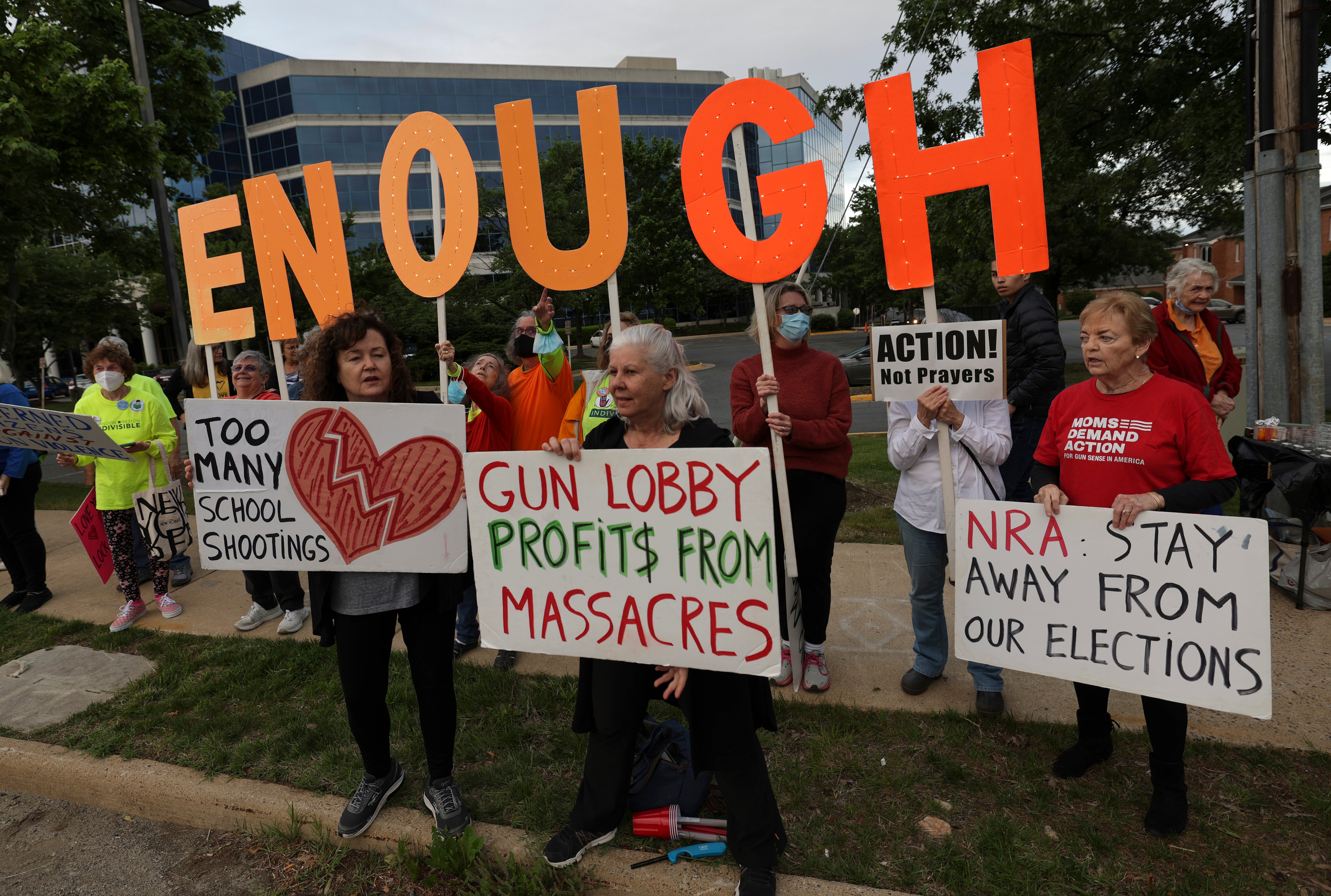 Gun-control advocates hold a vigil outside the National Rifle Association headquarters in Fairfax, Virginia