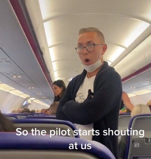 Passengers on the grounded Wizz Air flight react to the angry pilot