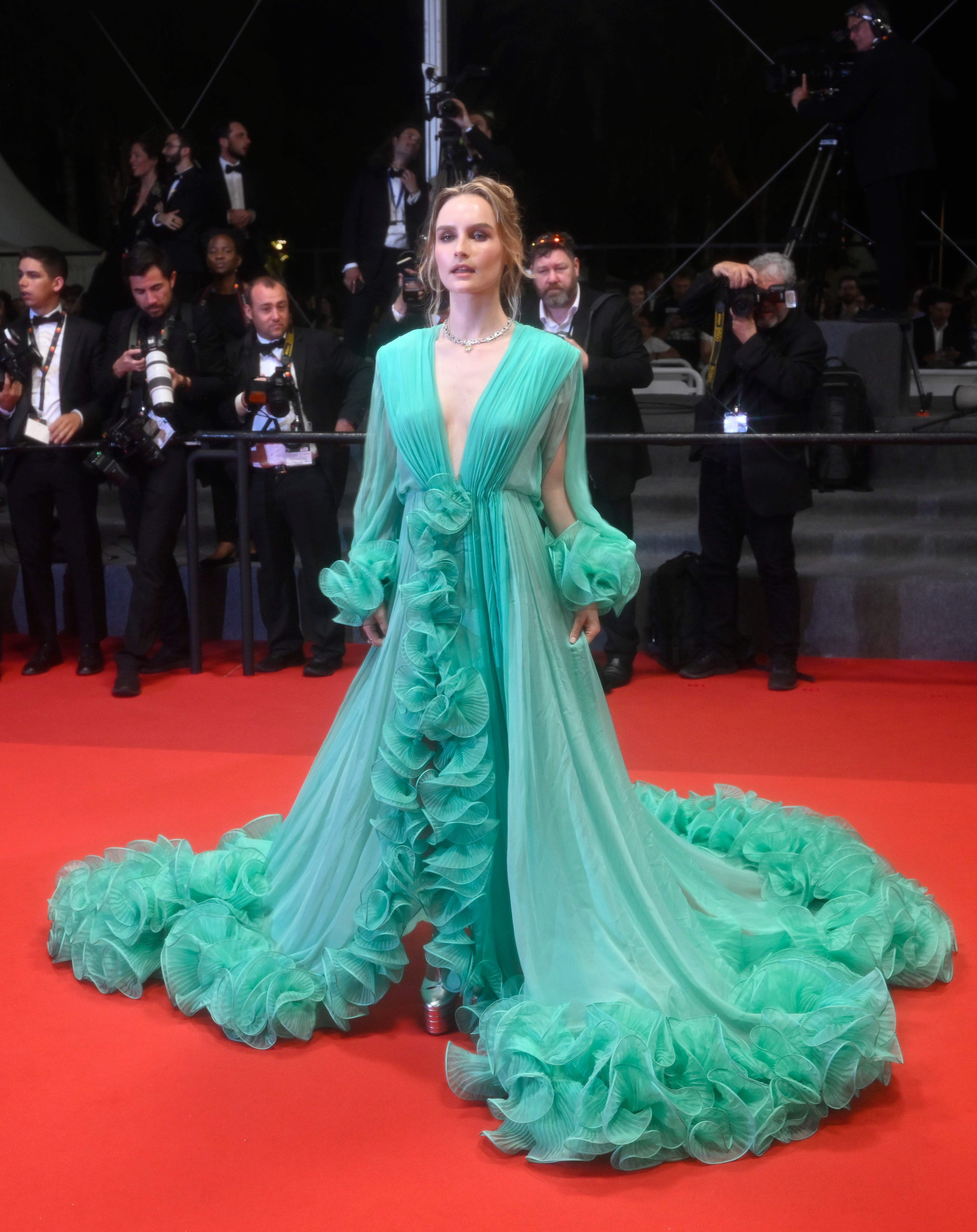 Olivia DeJonge departs the screening of "Elvis" during the 75th annual Cannes film festival at Palais des Festivals