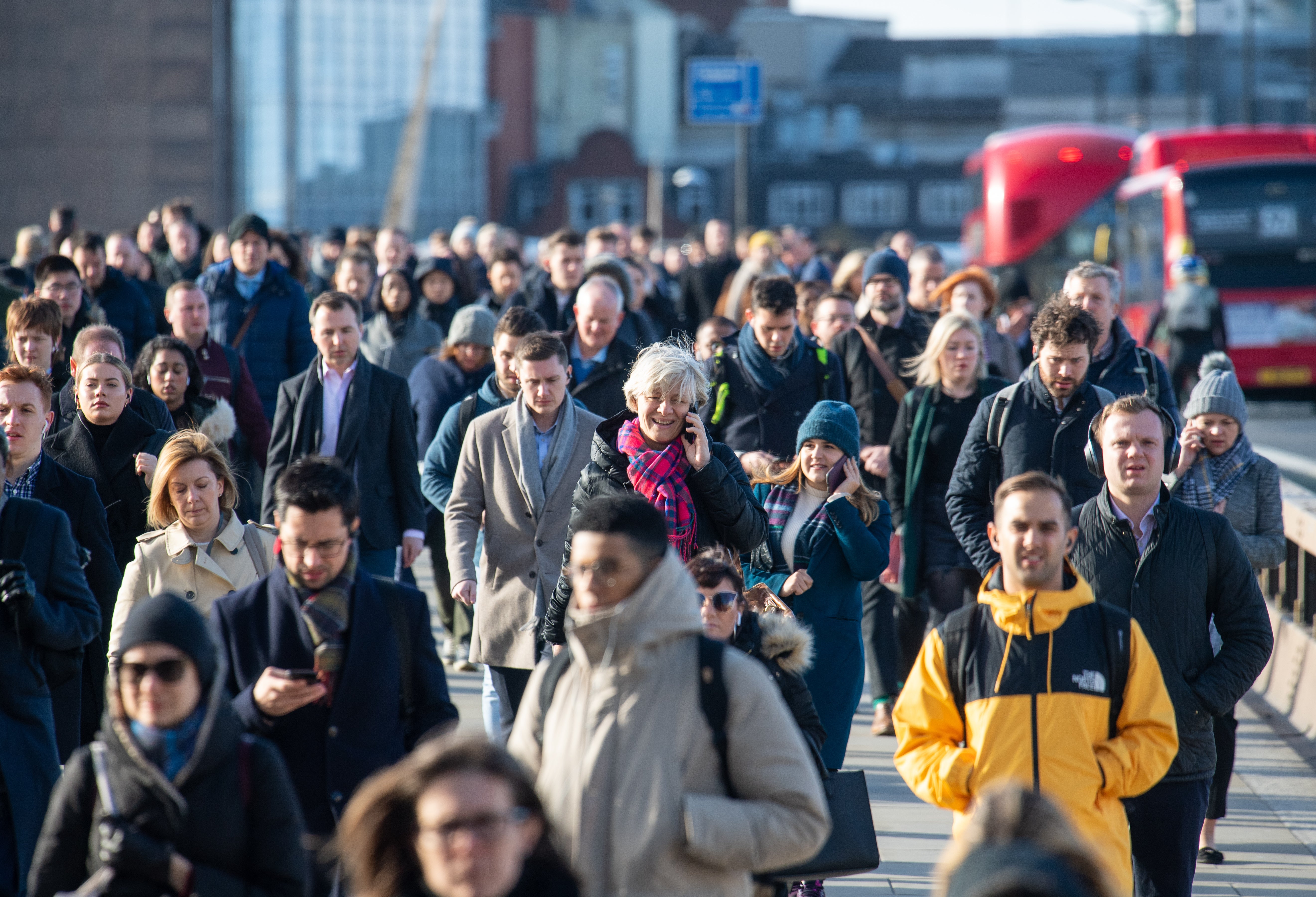 Commuters crossing London Bridge, in central London (Dominic Lipinski/PA)