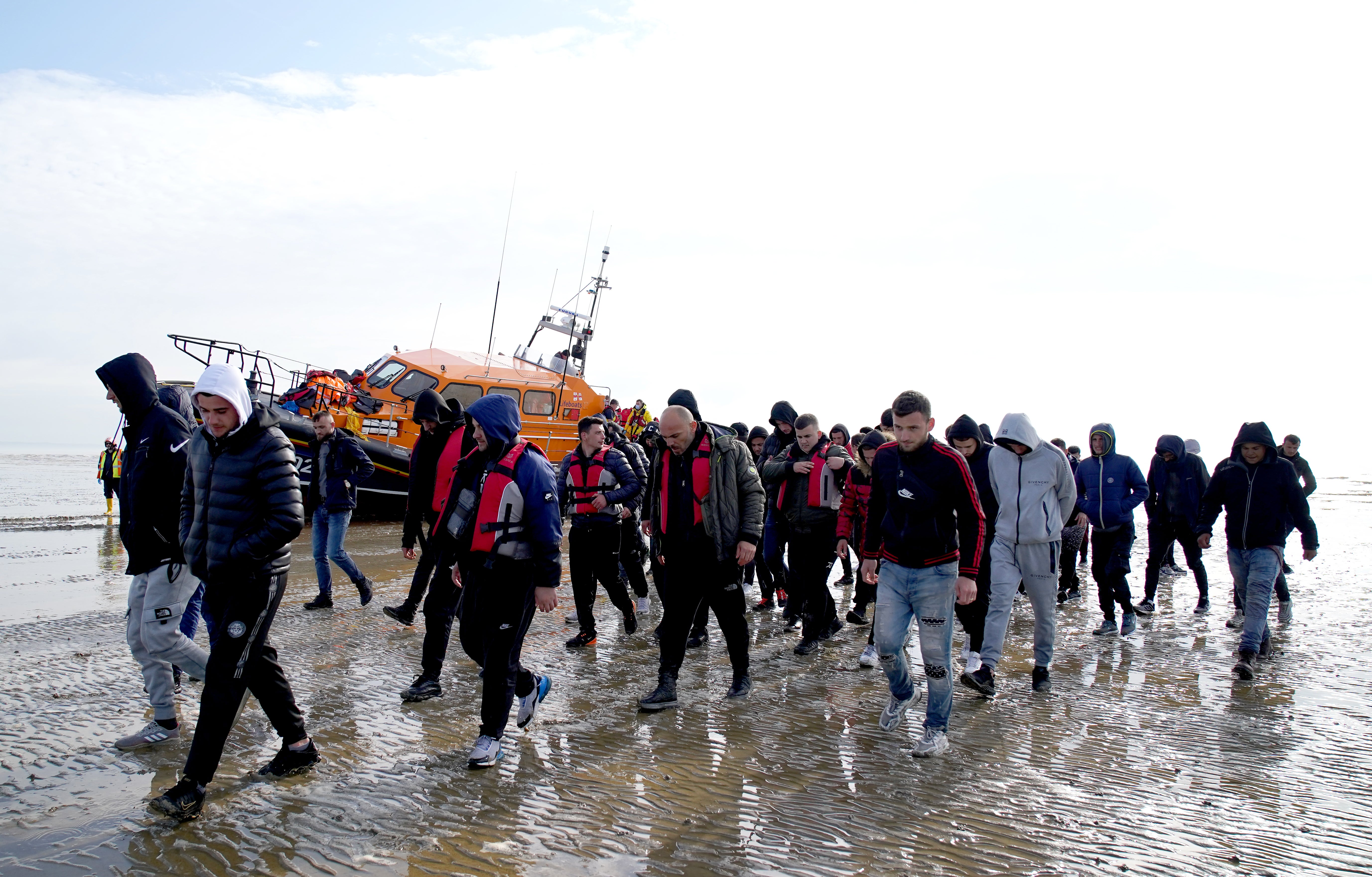 A group of people thought to be migrants are brought in to Dungeness, Kent, onboard the RNLI Dungeness Lifeboat, following a small boat incident in the Channel. Picture date: Tuesday May 17, 2022. (Gareth Fuller/PA)