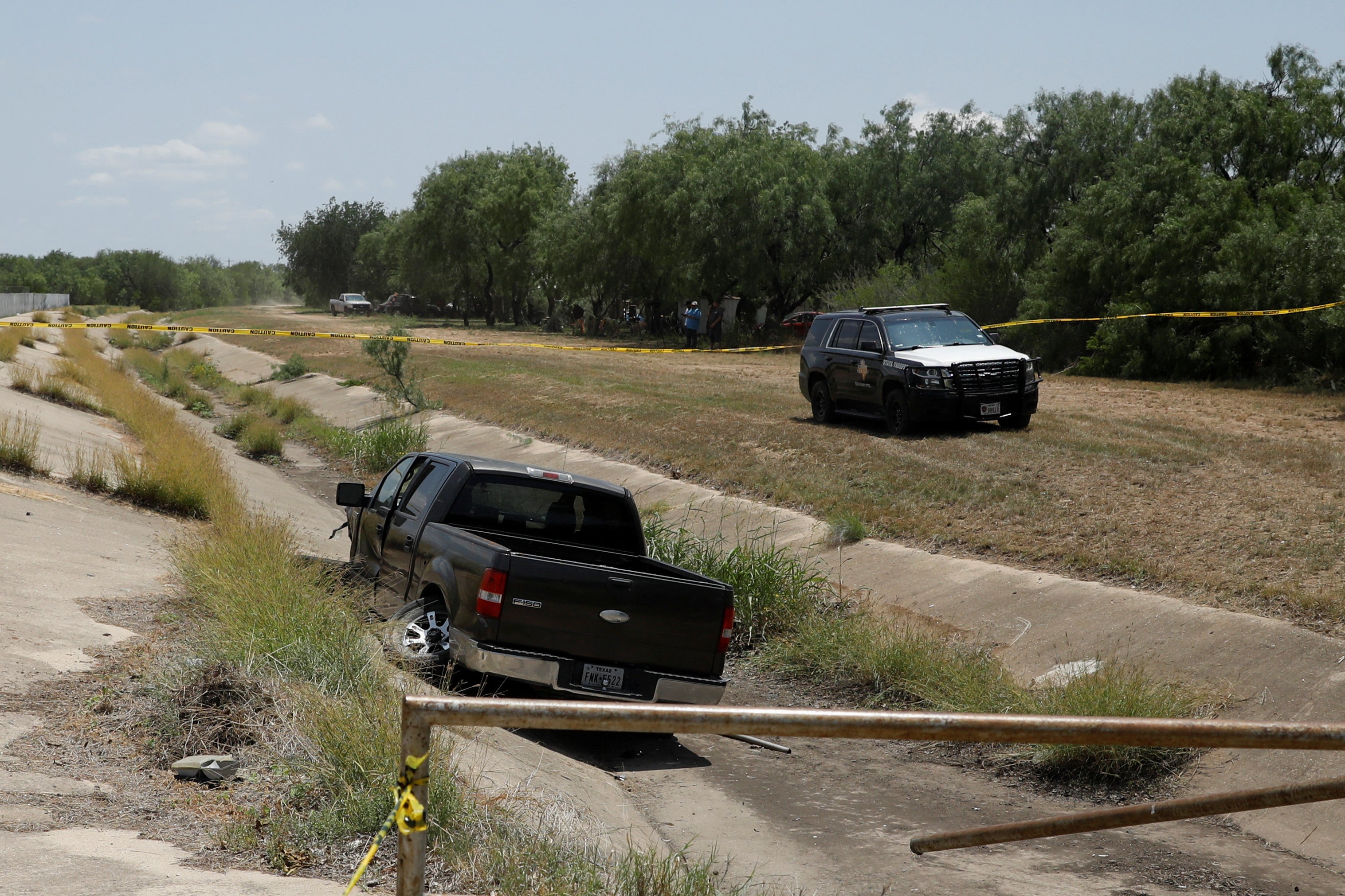 A police vehicle is seen parked near of a truck believed to belong to the suspect of a shooting at Robb Elementary School after a shooting, in Uvalde, Texas, U.S. May 24, 2022