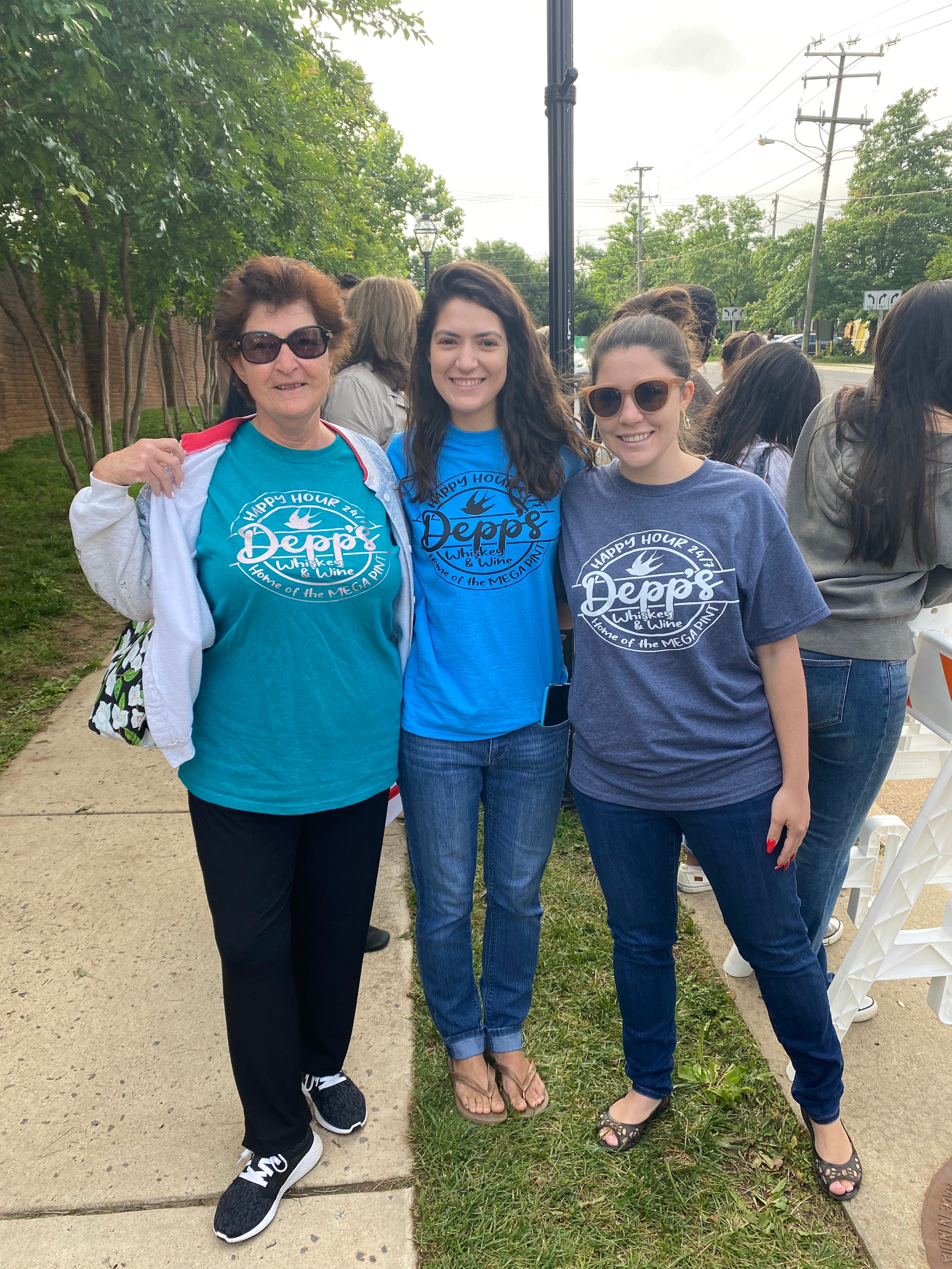 Supporters of Johnny Depp wear t-shirts with quotes from his now-in famous testimony