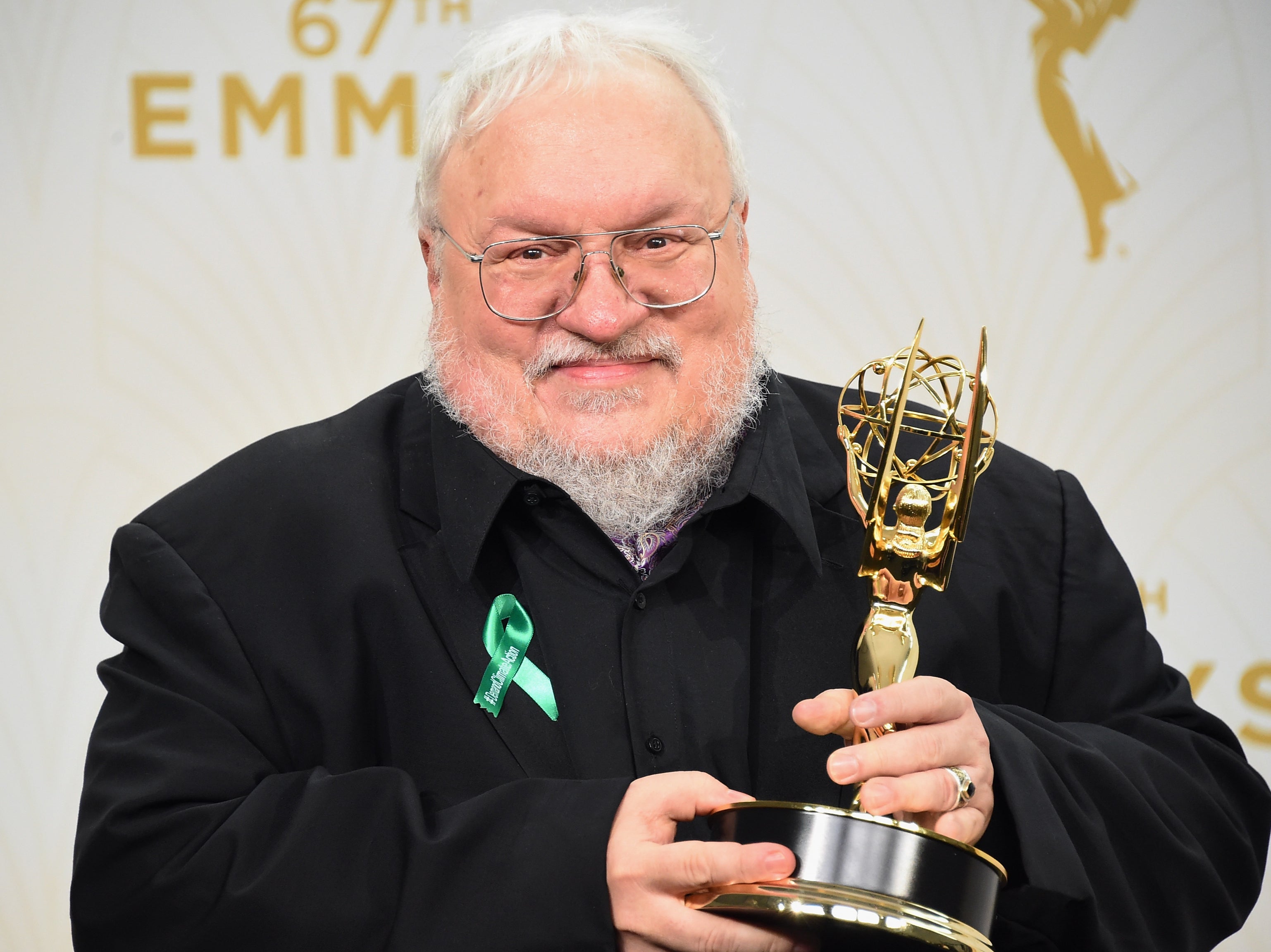 Martin holds aloft the Emmy for Outstanding Drama Series awarded to ‘Game of Thrones’ in 2015