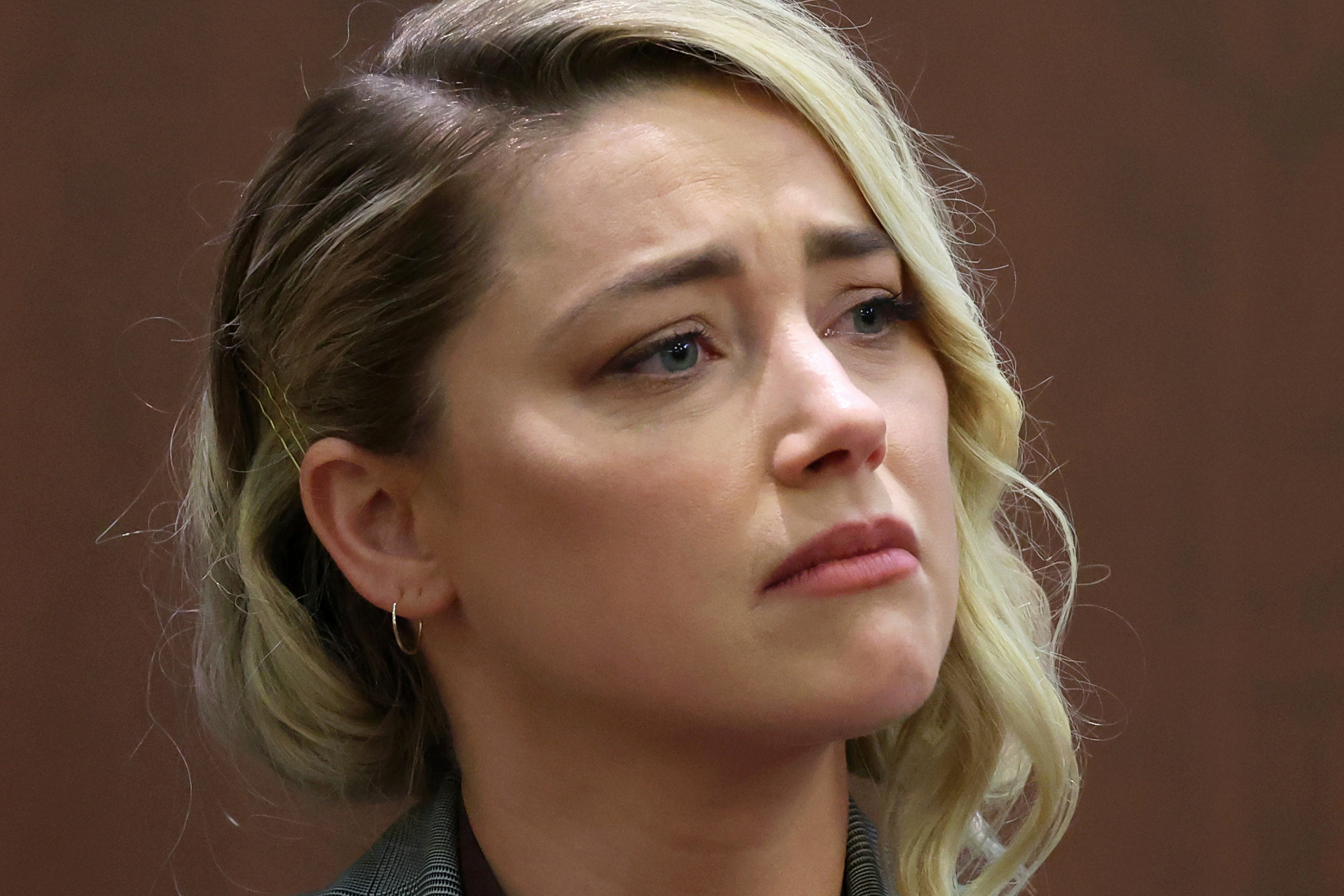 Amber Heard giving testimony during the trial