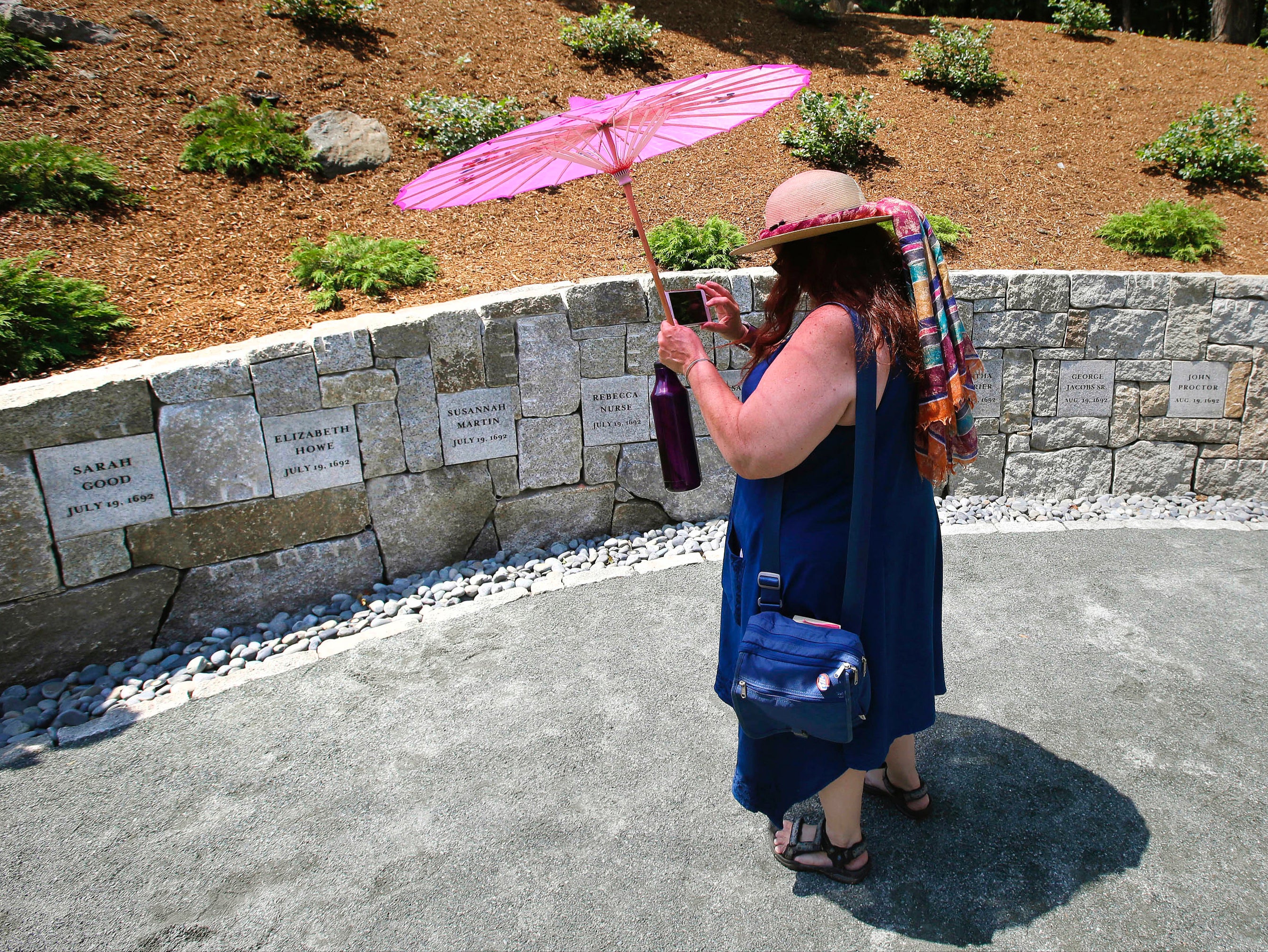 A school teacher at the memorial for the Salem witches