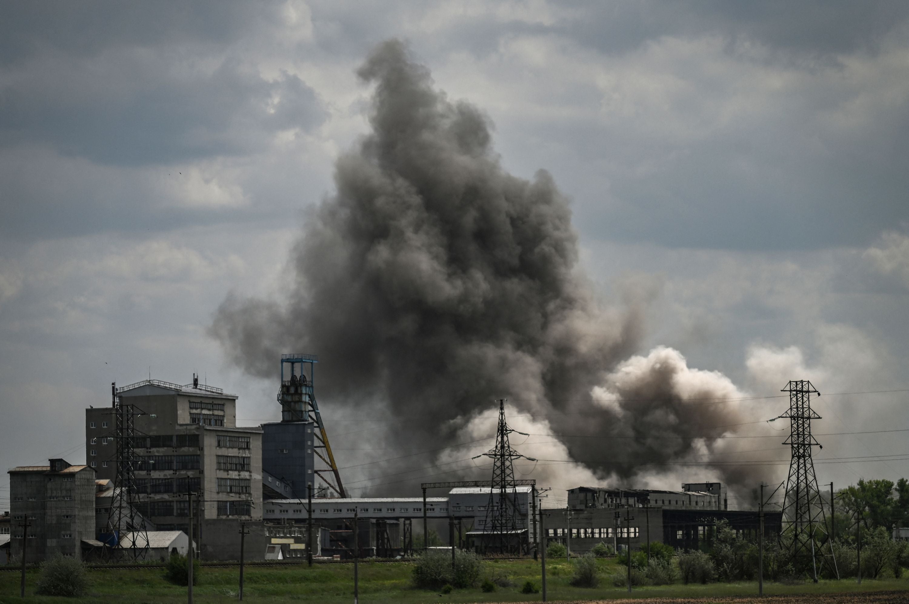 Smoke and dirt ascends after a strike at a factory in the city of Soledar at the eastern Ukranian region of Donbas