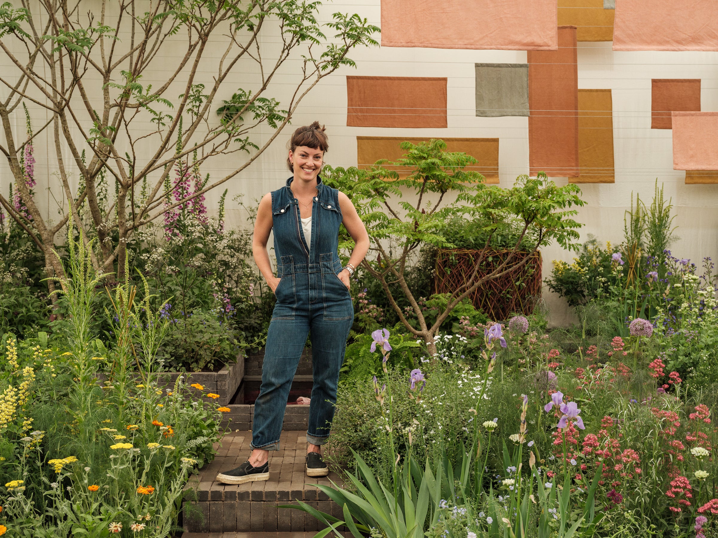 Horticulturalist Lottie Delamain in her garden at Chelsea Flower Show