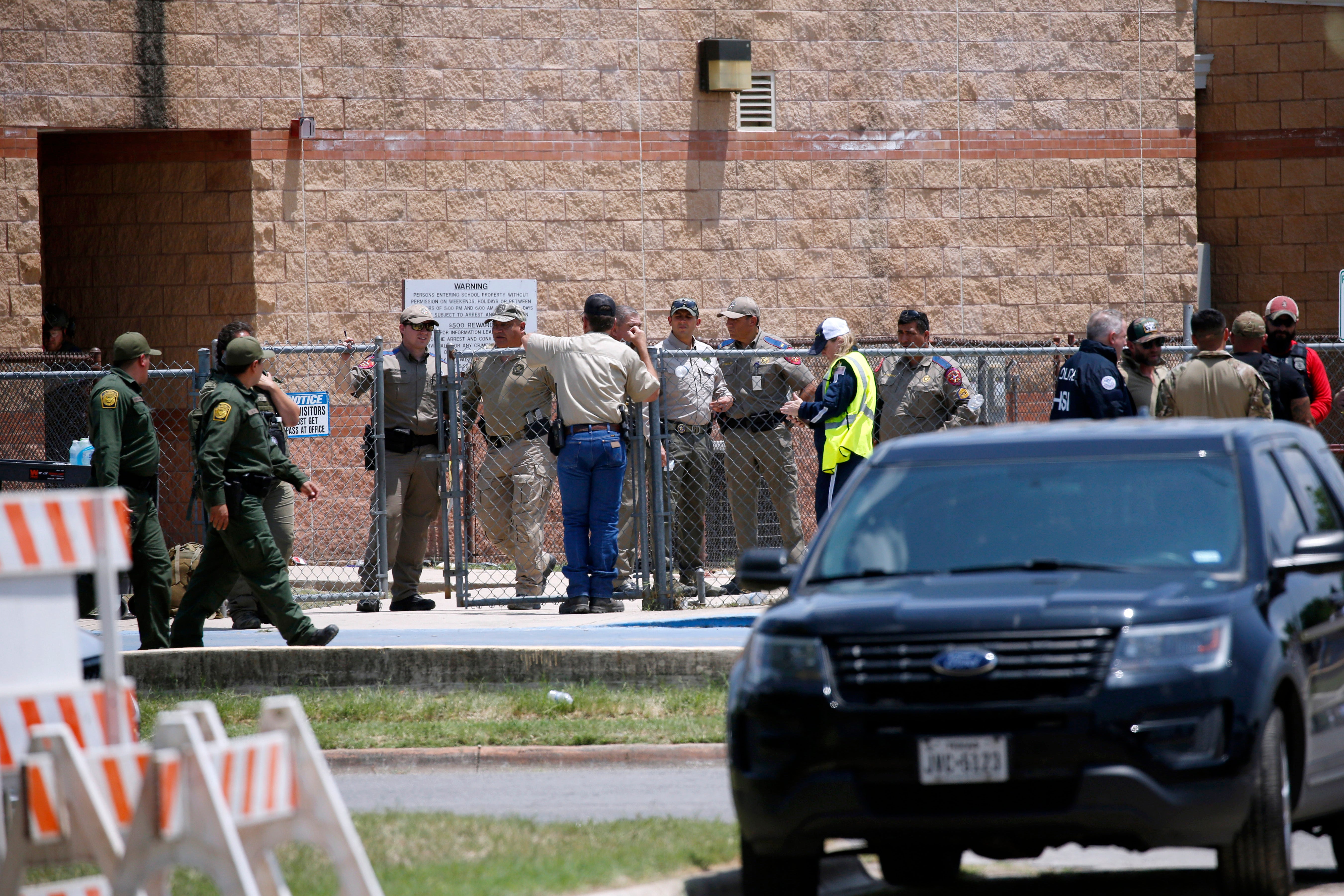 Law enforcement, and other first responders, gather outside Robb Elementary School following a shooting, May 24, 2022, in Uvalde, Texas.