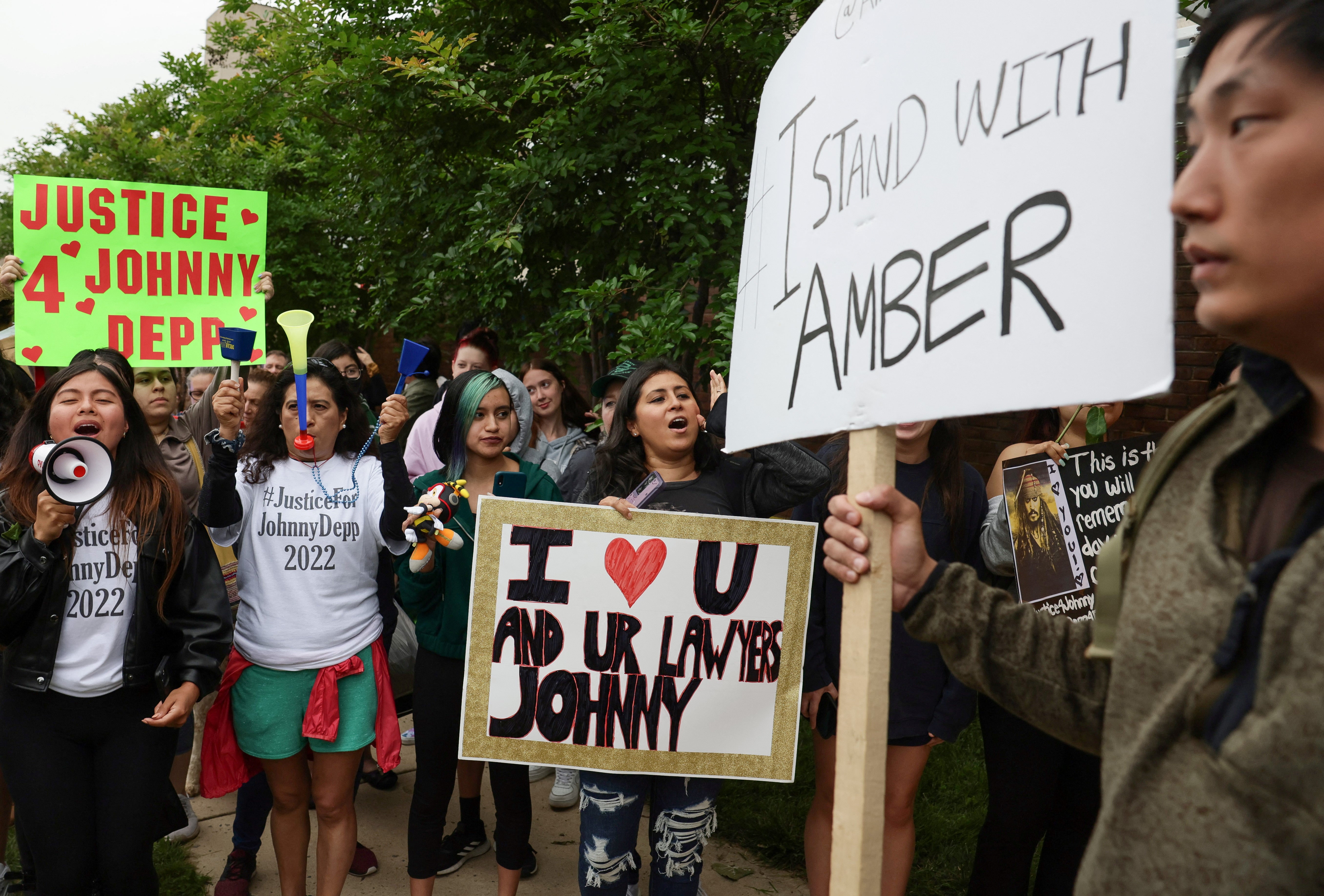 Supporters of Johnny Depp and Amber Heard line the street outside the courthouse in Fairfax on Friday