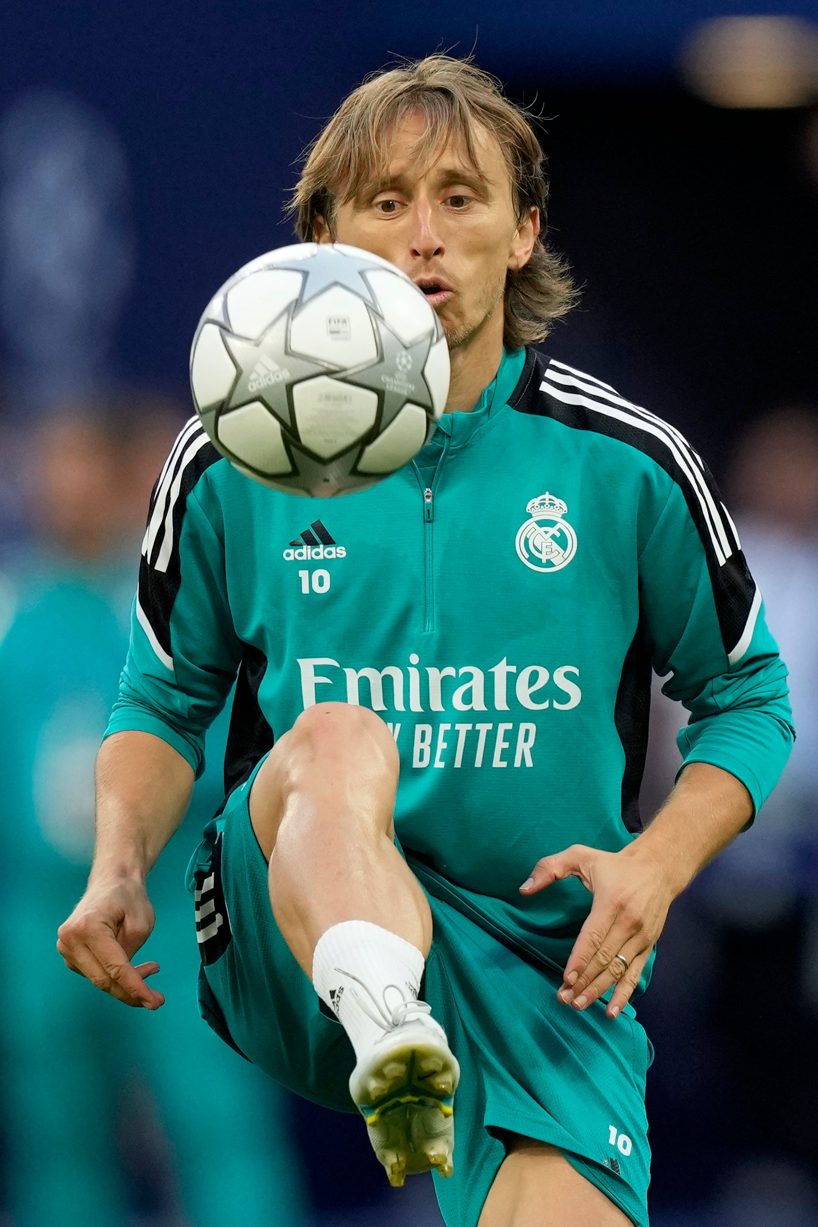 Luka Modric plays with a ball during a training session