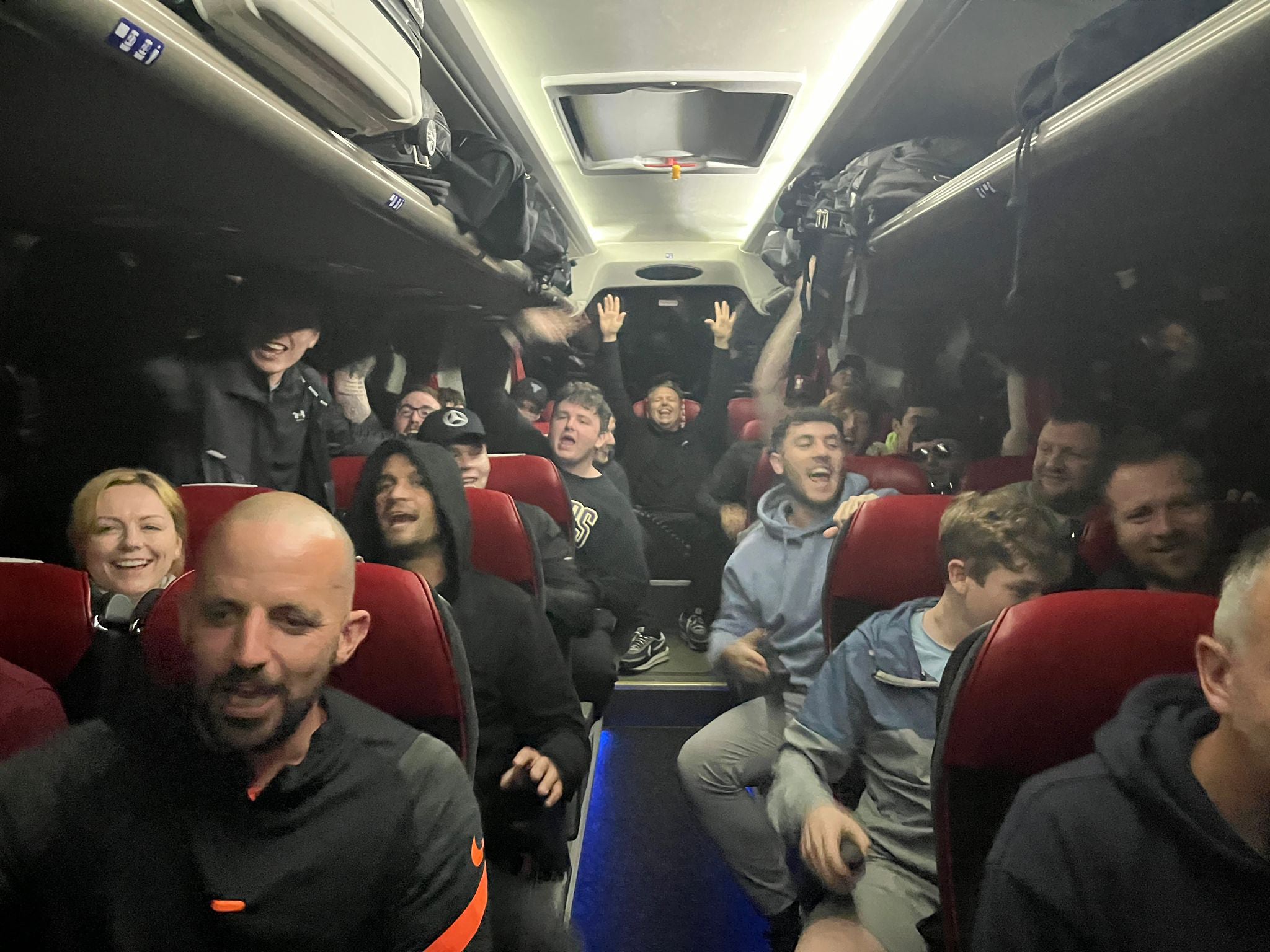 Liverpool fans in the coach provided by Simon Wilson (Simon Wilson/PA)