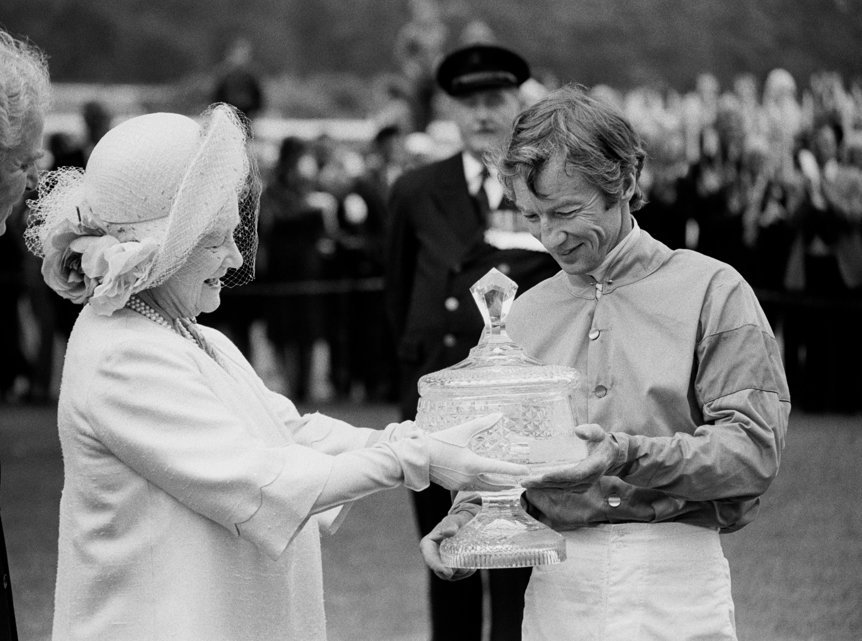 Lester Piggott receiving the Ritz Club trophy from the Queen Mother in 1981