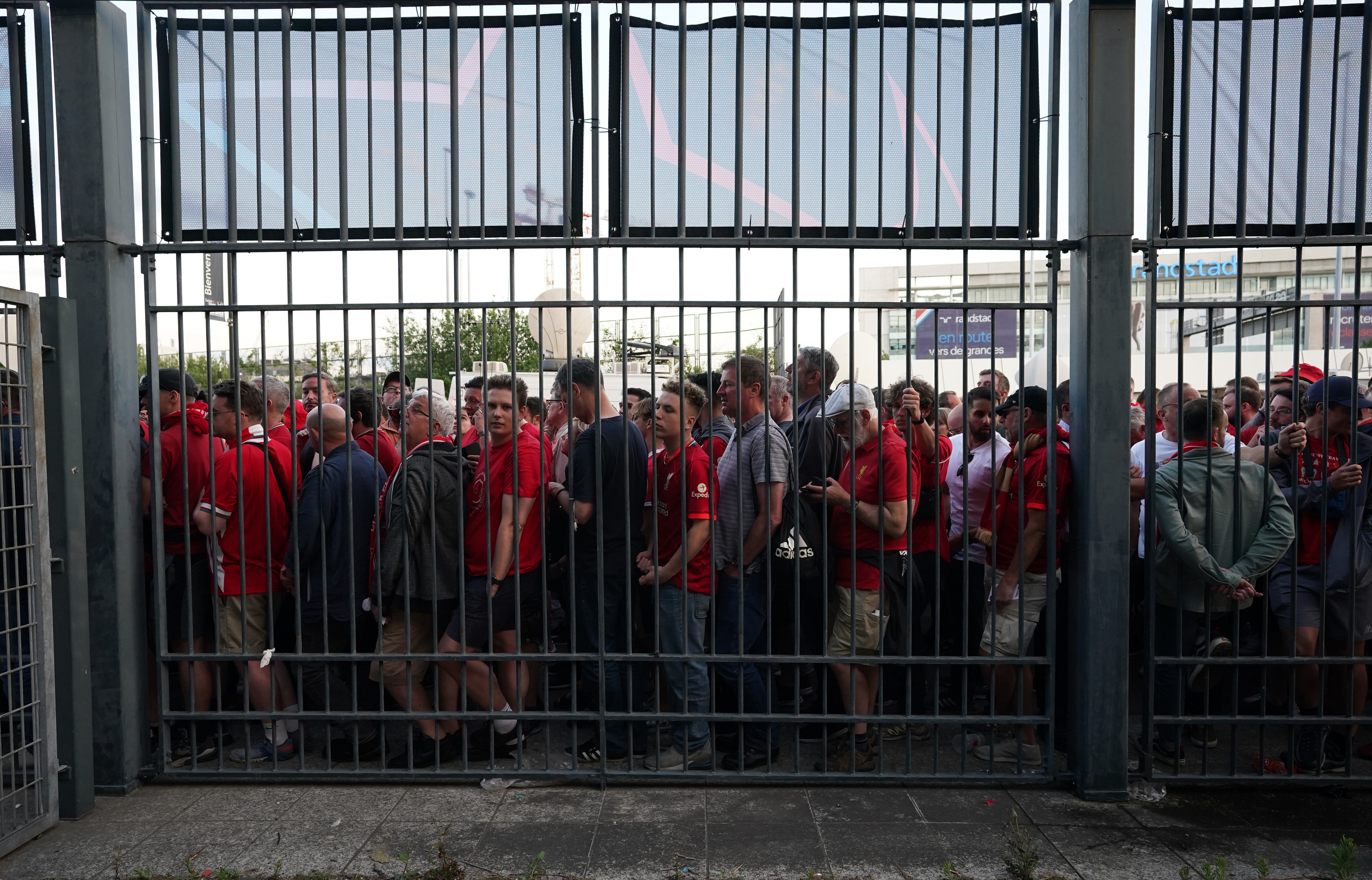 Fans gathered at the perimeter of the Stade de France ahead of the Champions League final in Paris (Nick Potts/PA)