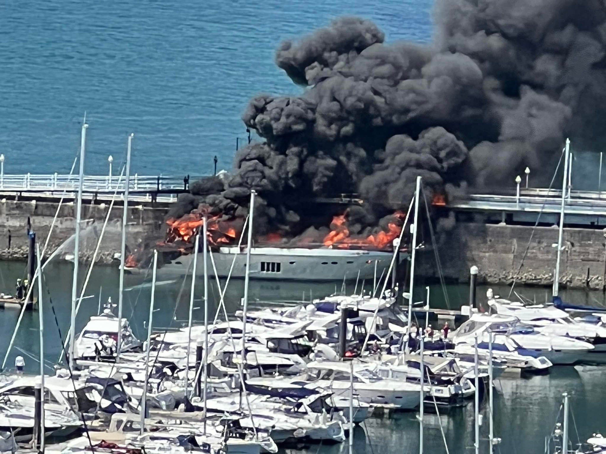 A superyacht which went up in flames while moored in a marina in Torquay (Tania Coatham/Twitter/PA)