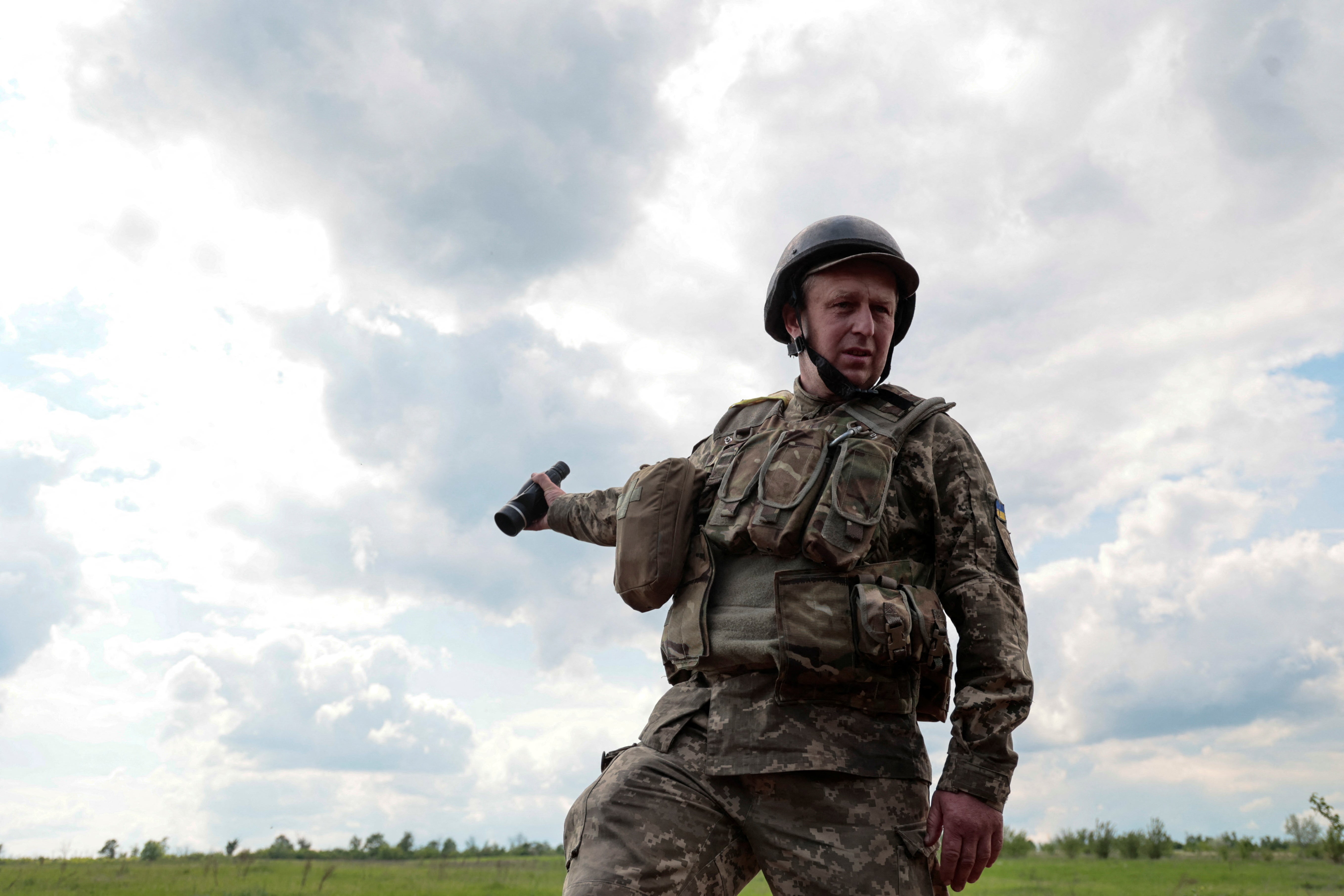 Dmytro, Ukrainian serviceman and former teacher of English language, gestures at a position near a frontline, as Russia's attack on Ukraine continues, in Donetsk