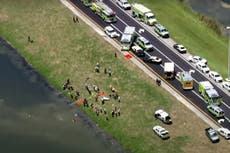 Police snipers surround alligator-infested Florida pond after deadly car crash
