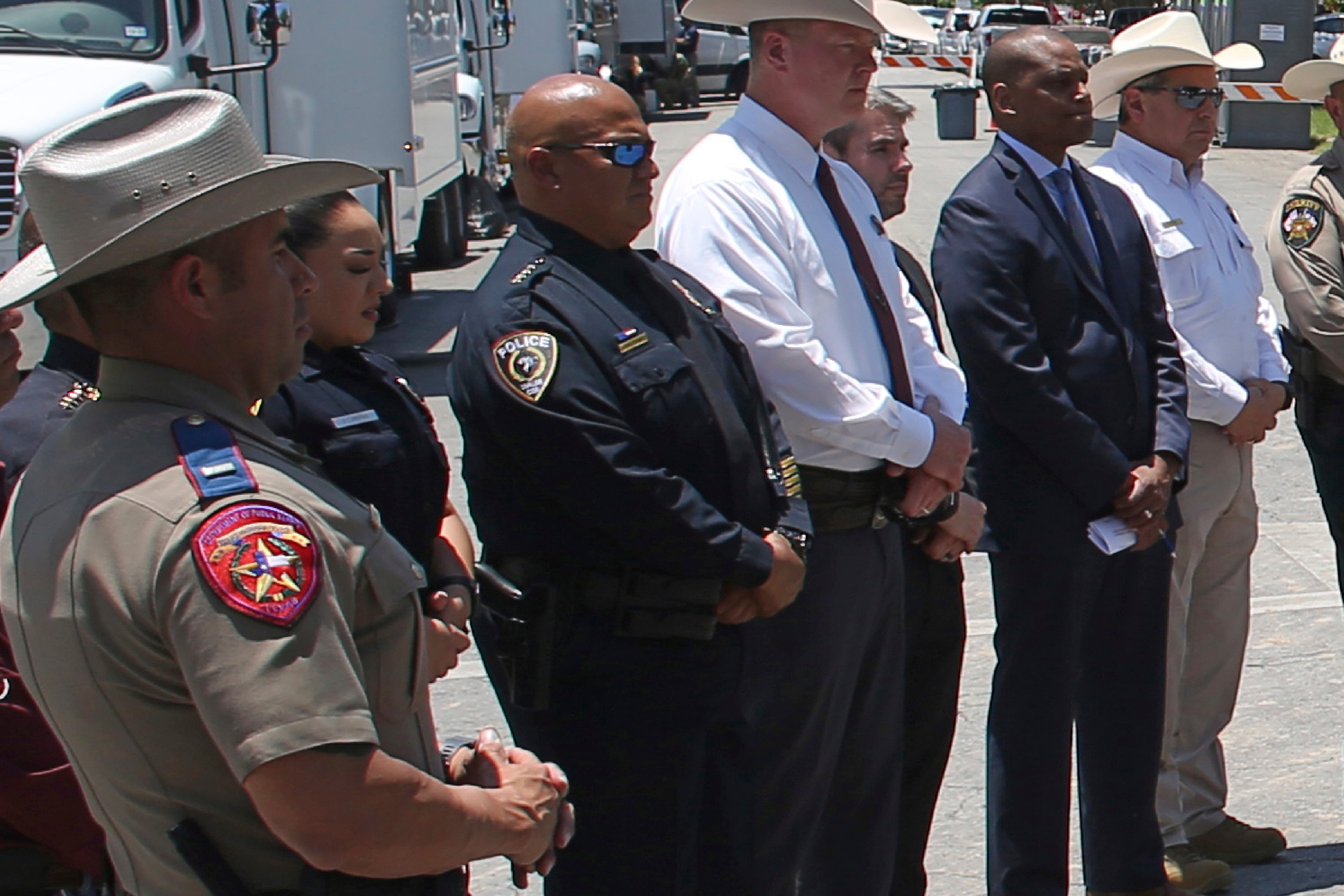 Uvalde school police chief Pete Arredondo, third from left, stands during a news conference outside of the Robb Elementary school in Uvalde, Texas, on Thursda 26 May 2022