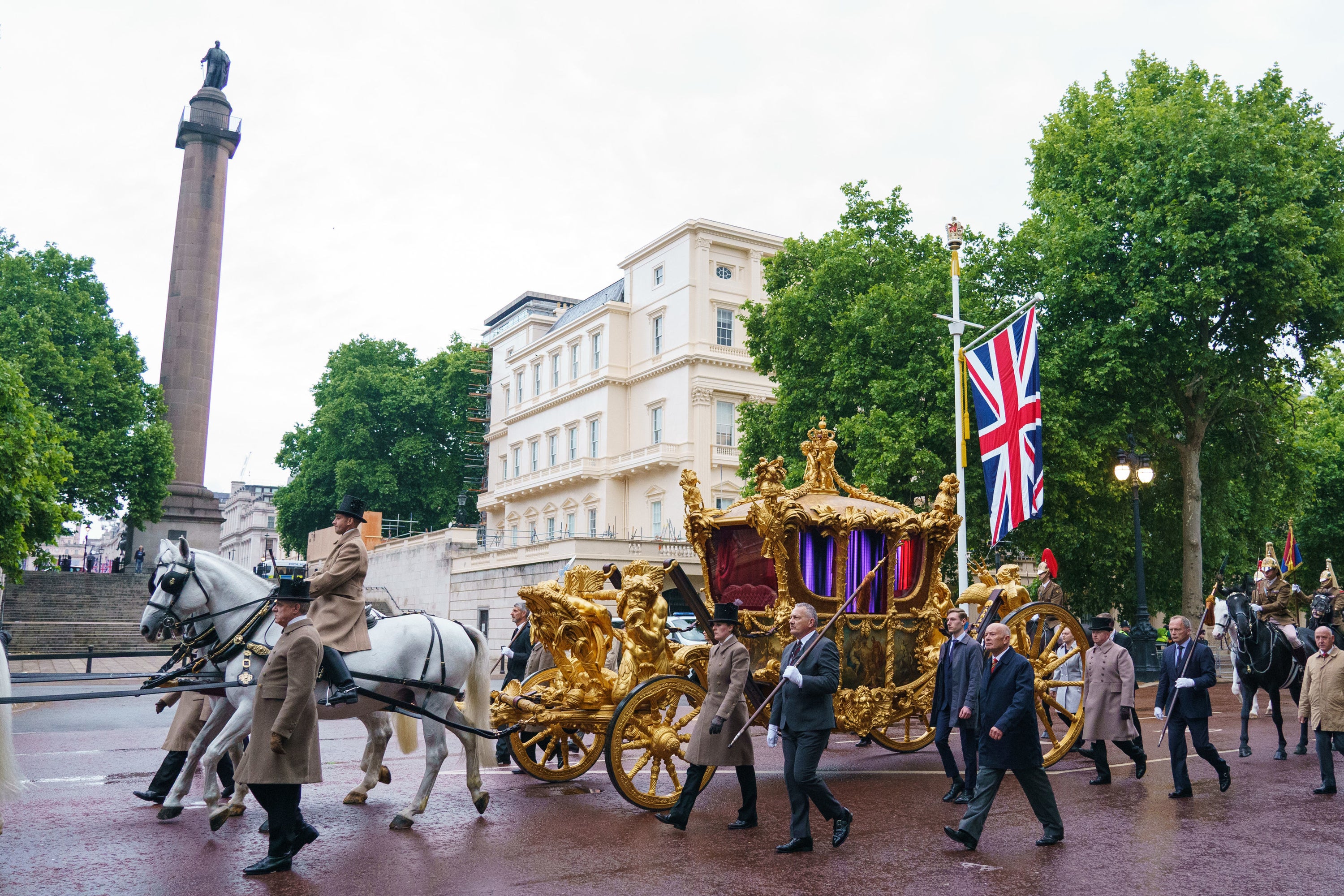 The gold state coach on The Mall during an early morning rehearsal (Dominic Lipinski/PA)