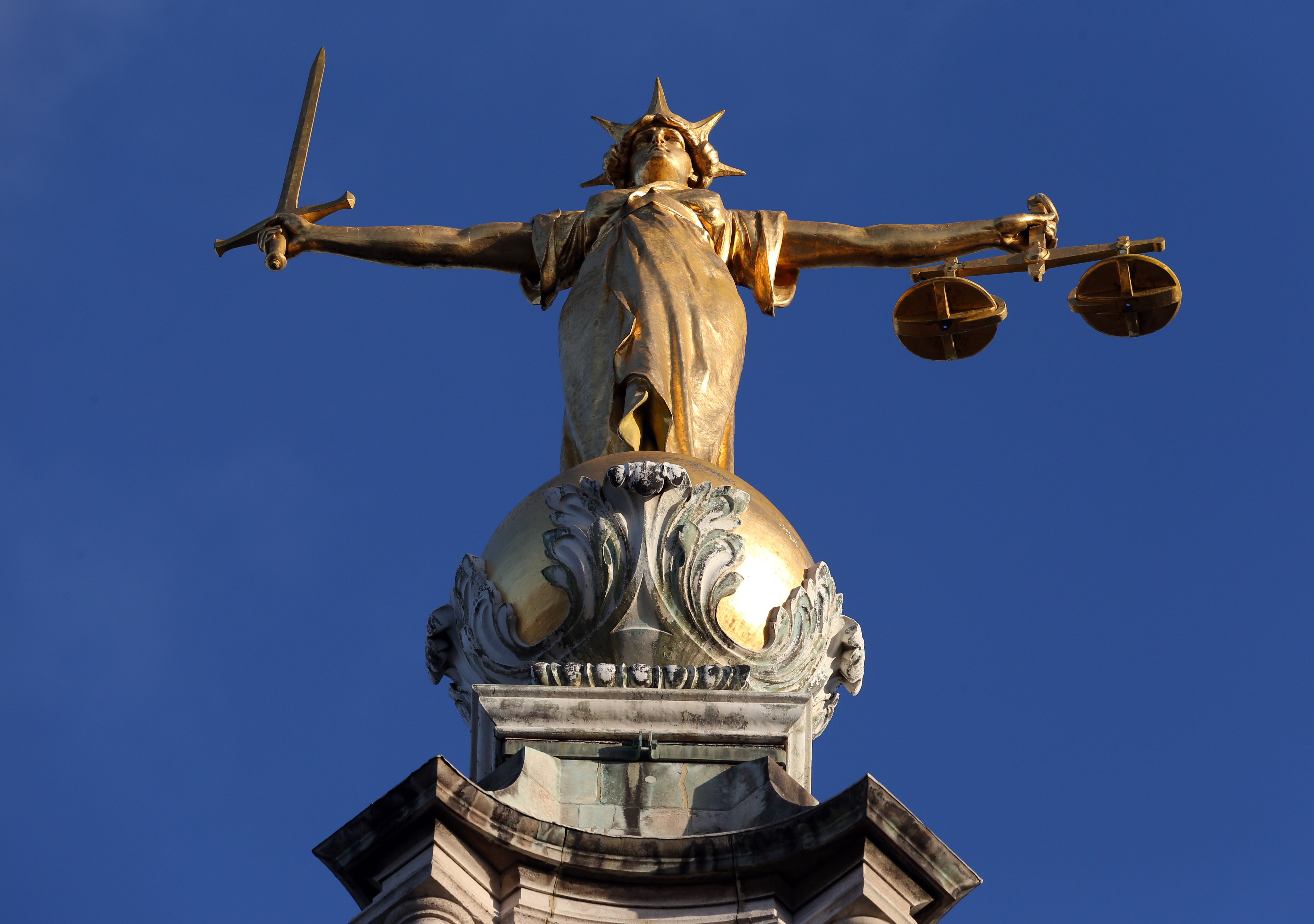 FW Pomeroy’s Statue of Justice stands atop the Central Criminal Court building, Old Bailey, London.