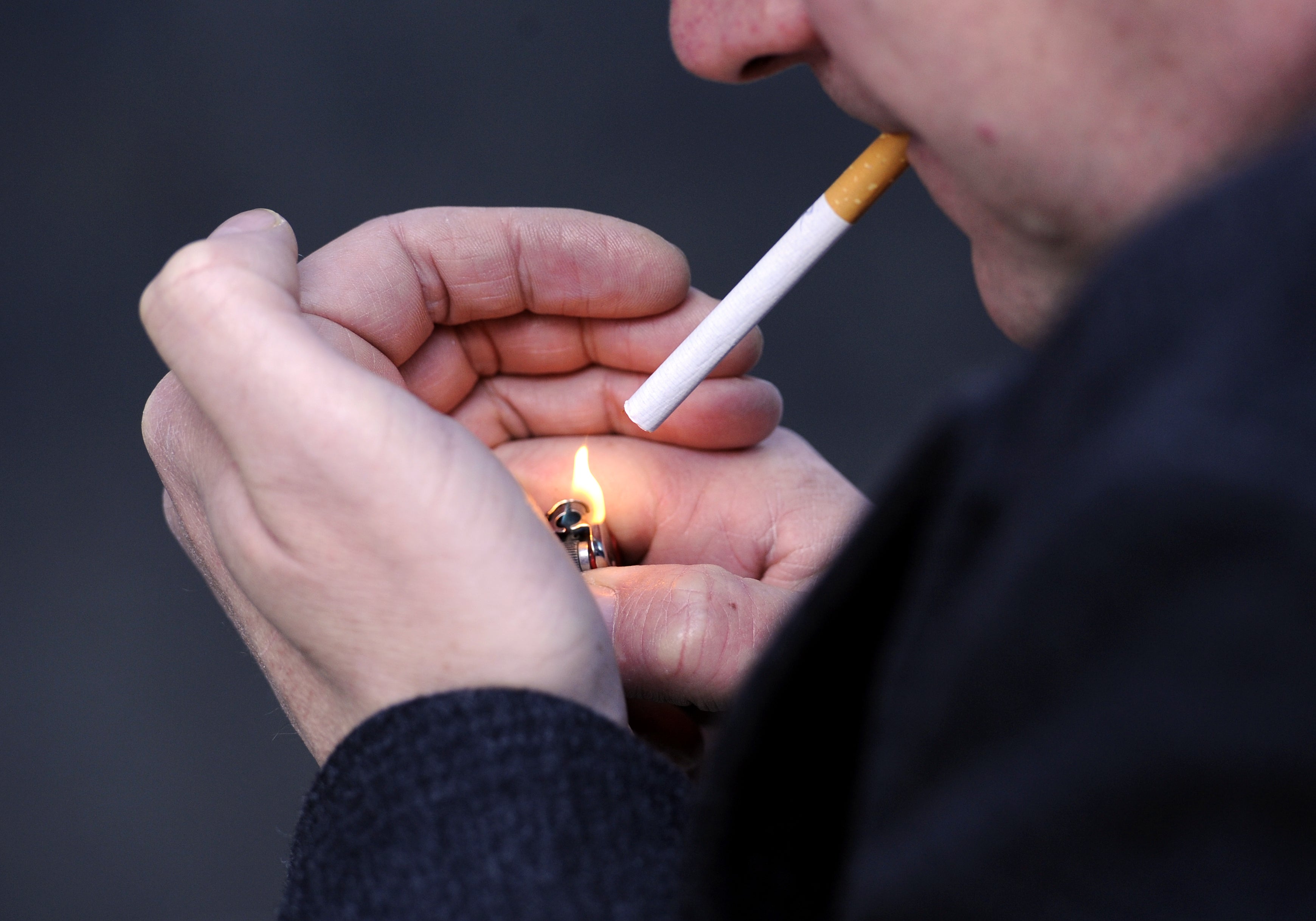 Smokers tend to keep up the habit even during hard economic times. (Jonathan Brady/PA)