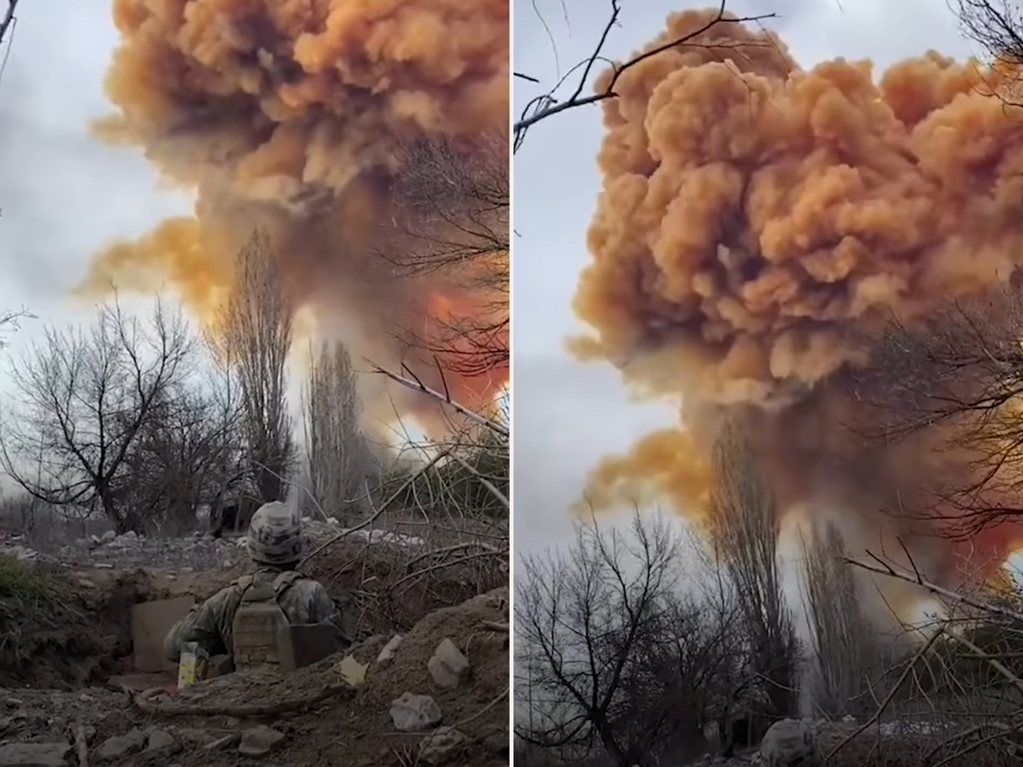 A soldier watches on as nitric acid rises into the sky