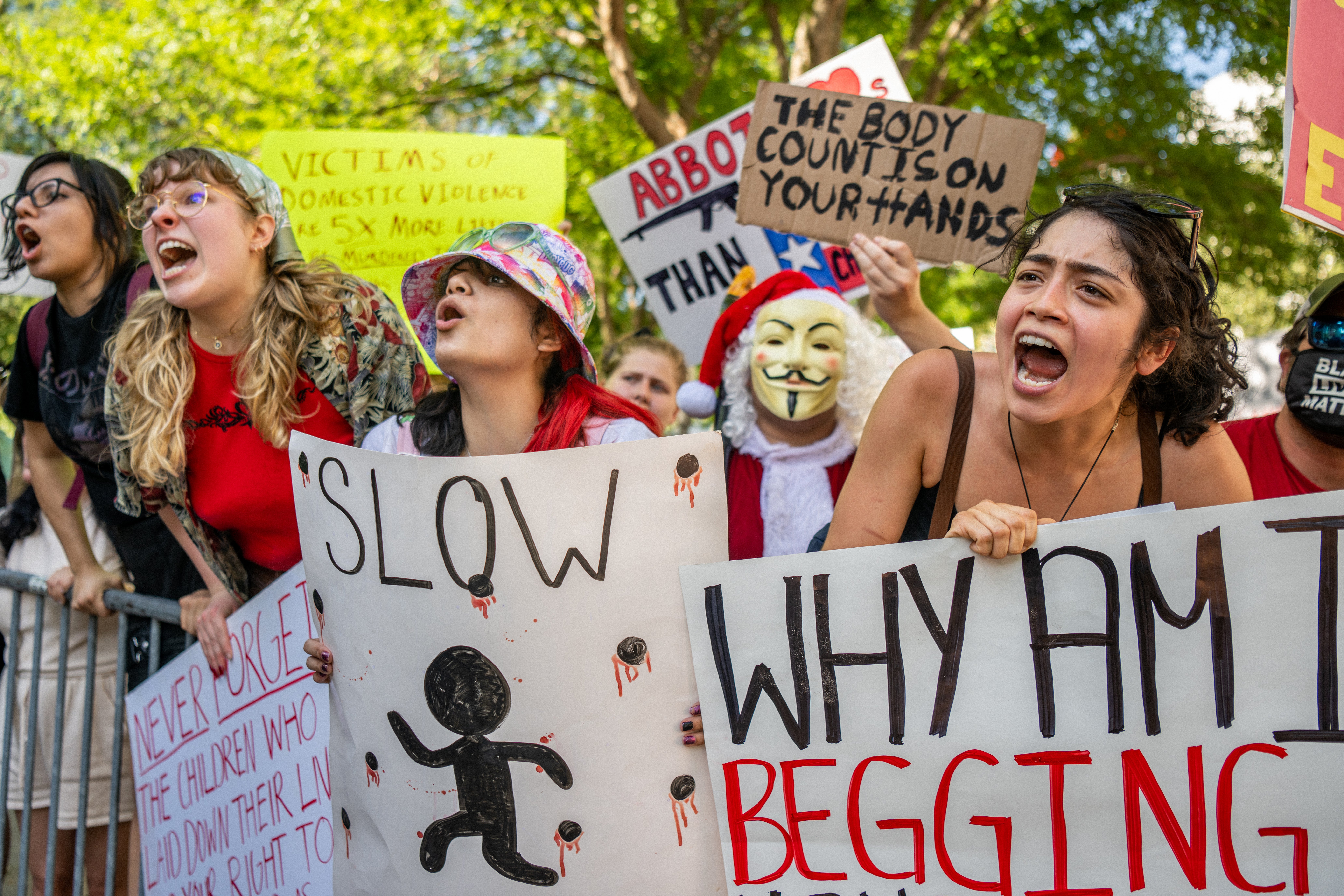 Gun control advocates confront attendees of the National Rifle Association (NRA) annual convention at the George R. Brown Convention Center on May 28, 2022 in Houston, Texas.