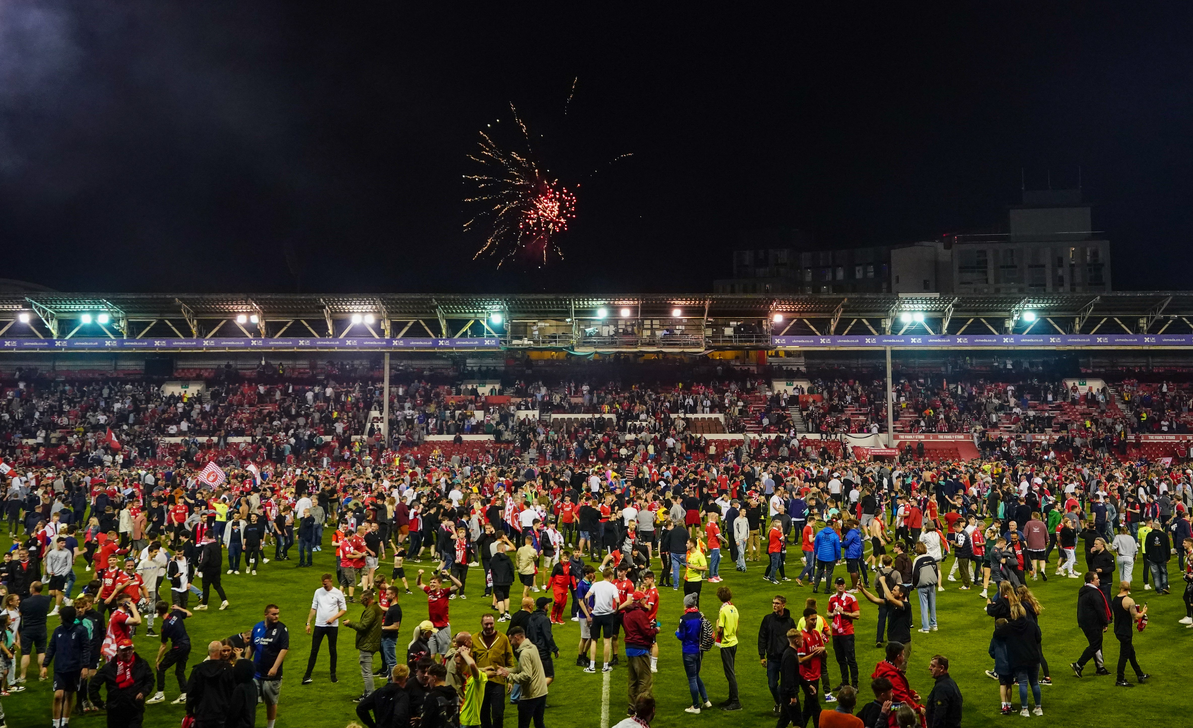 Pitch invasions became a common sight at the end of the season (Zac Goodwin/PA)