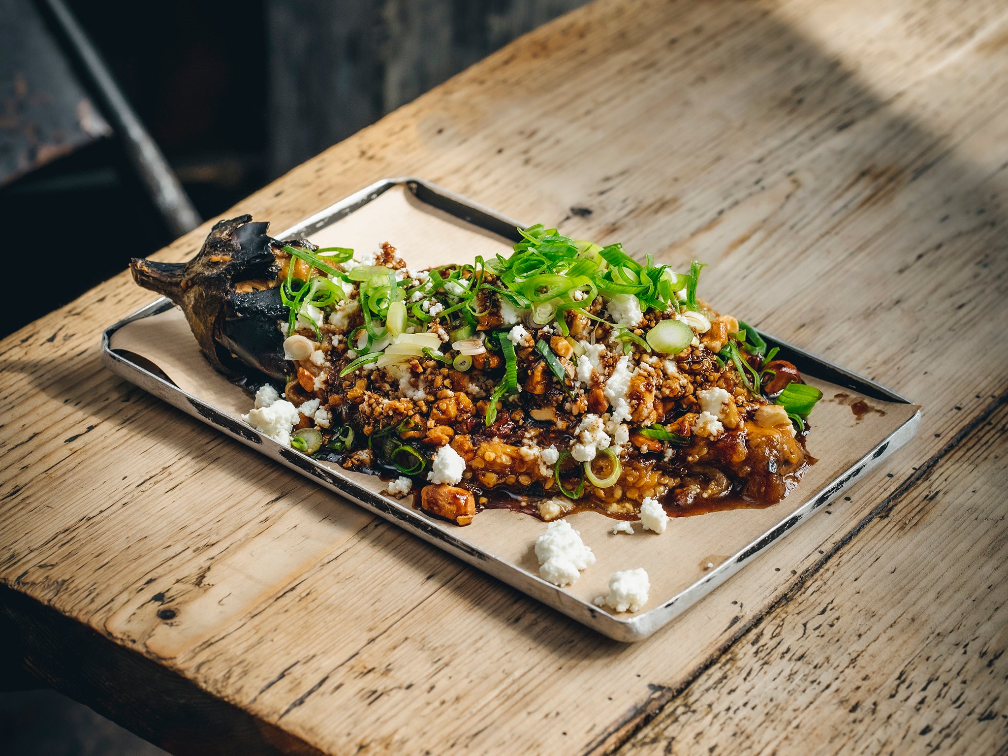 Coal-roasted aubergine with red miso, feta and toasted cashew