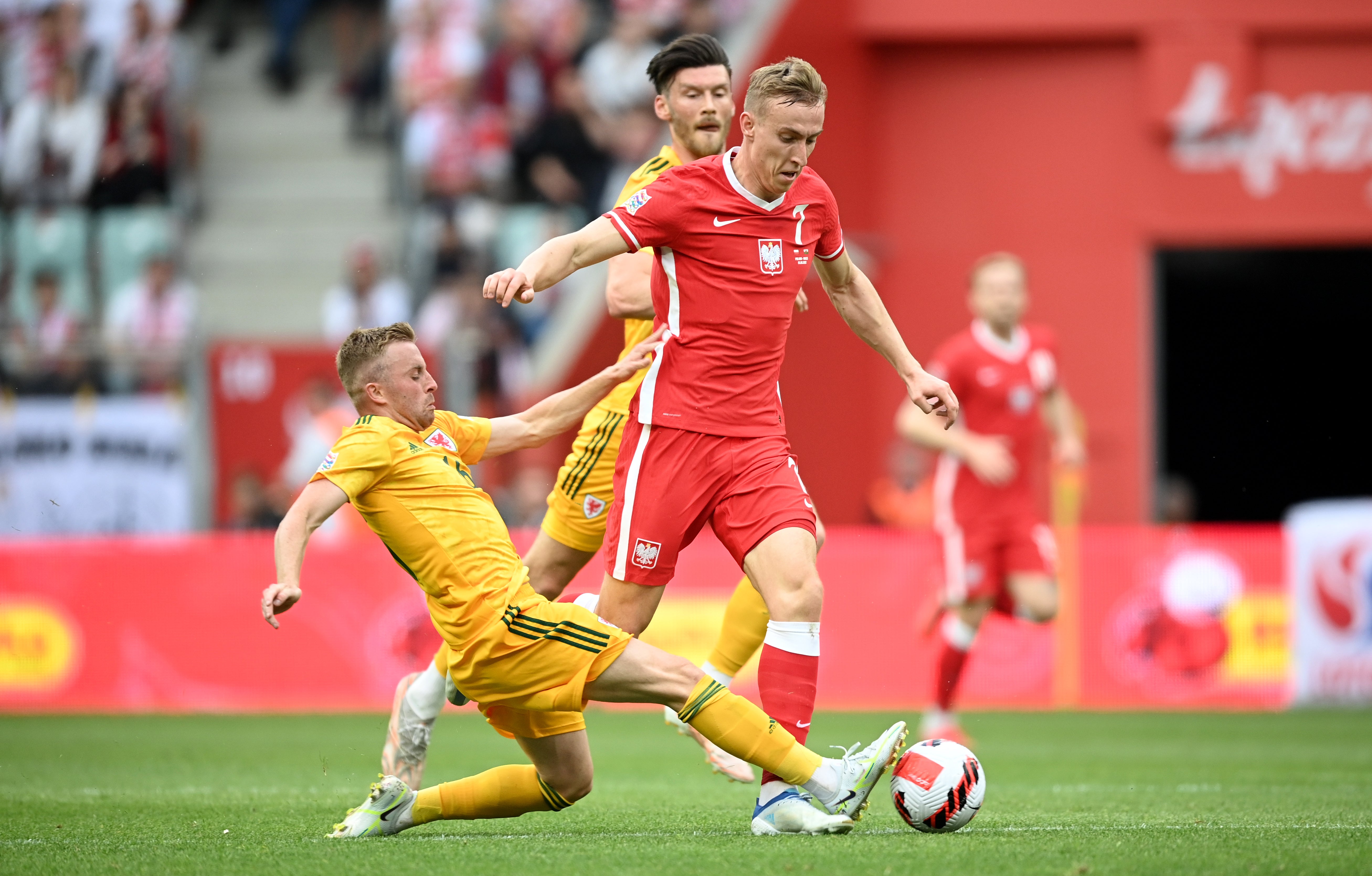 Joe Morrell, left, says World Cup qualification will inspire the next generation of Welsh footballers (Rafal Oleksiewicz/PA)